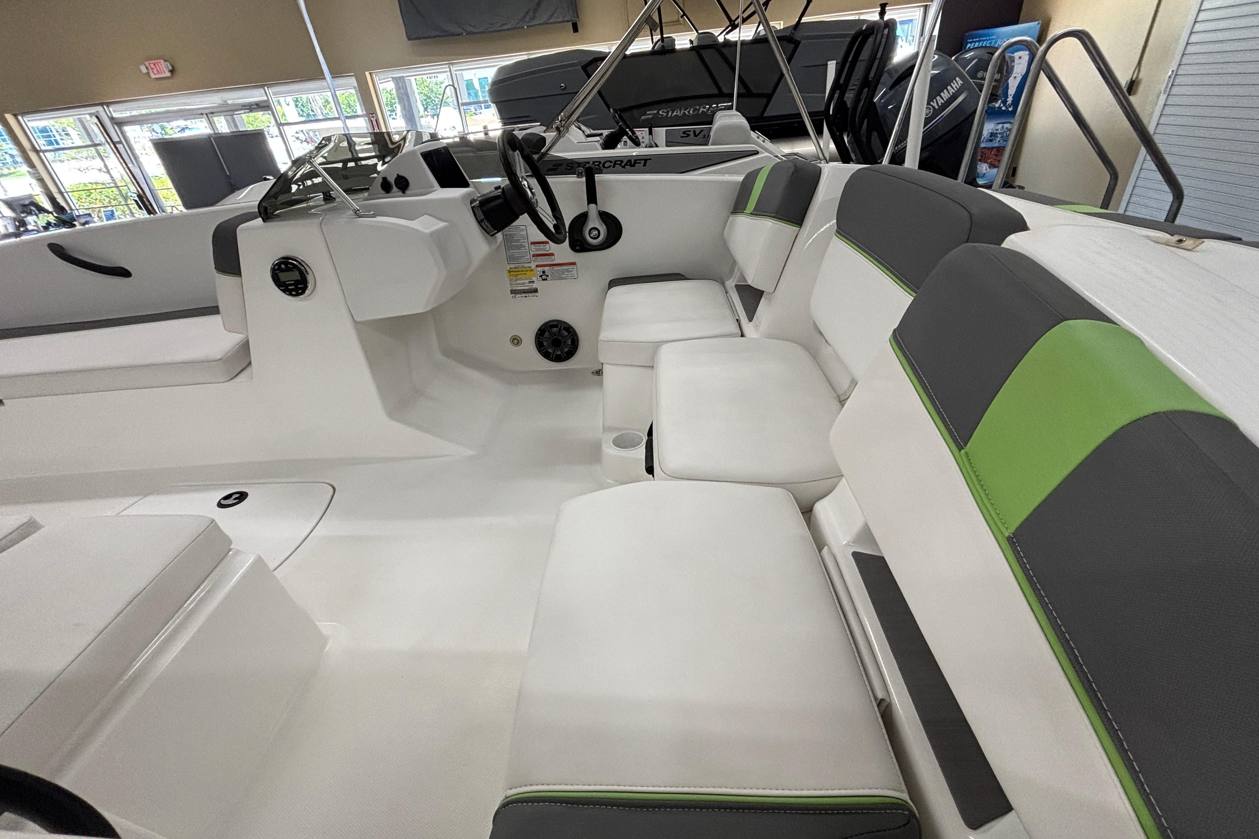 2024 Tahoe T18 boat interior with white and green seating, modern design.