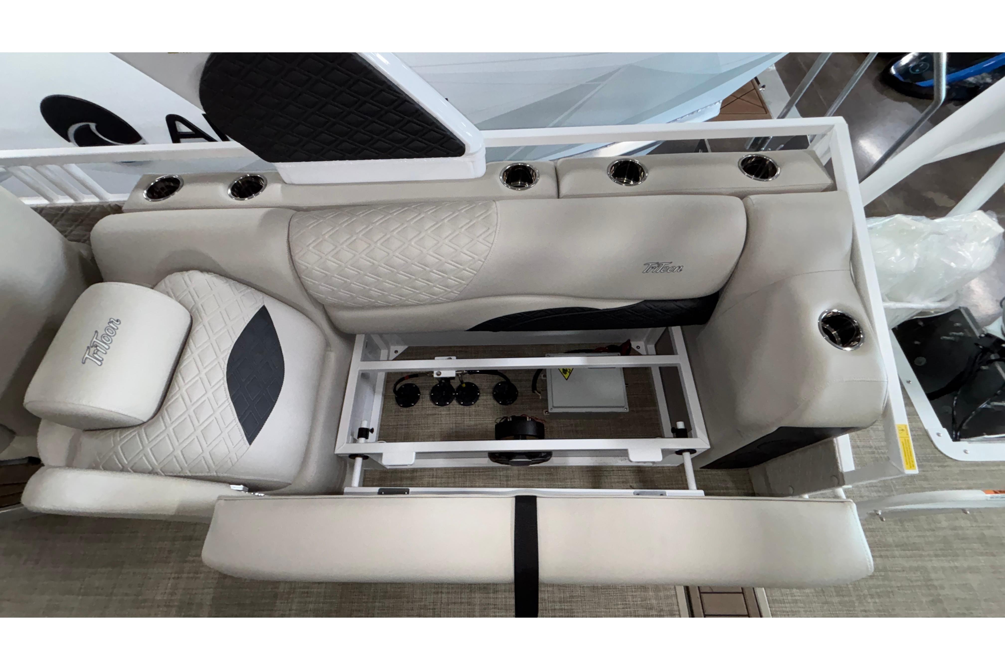 Luxurious seating on 2026 JC Sporttoon 26TT boat, featuring cup holders and quilted upholstery.