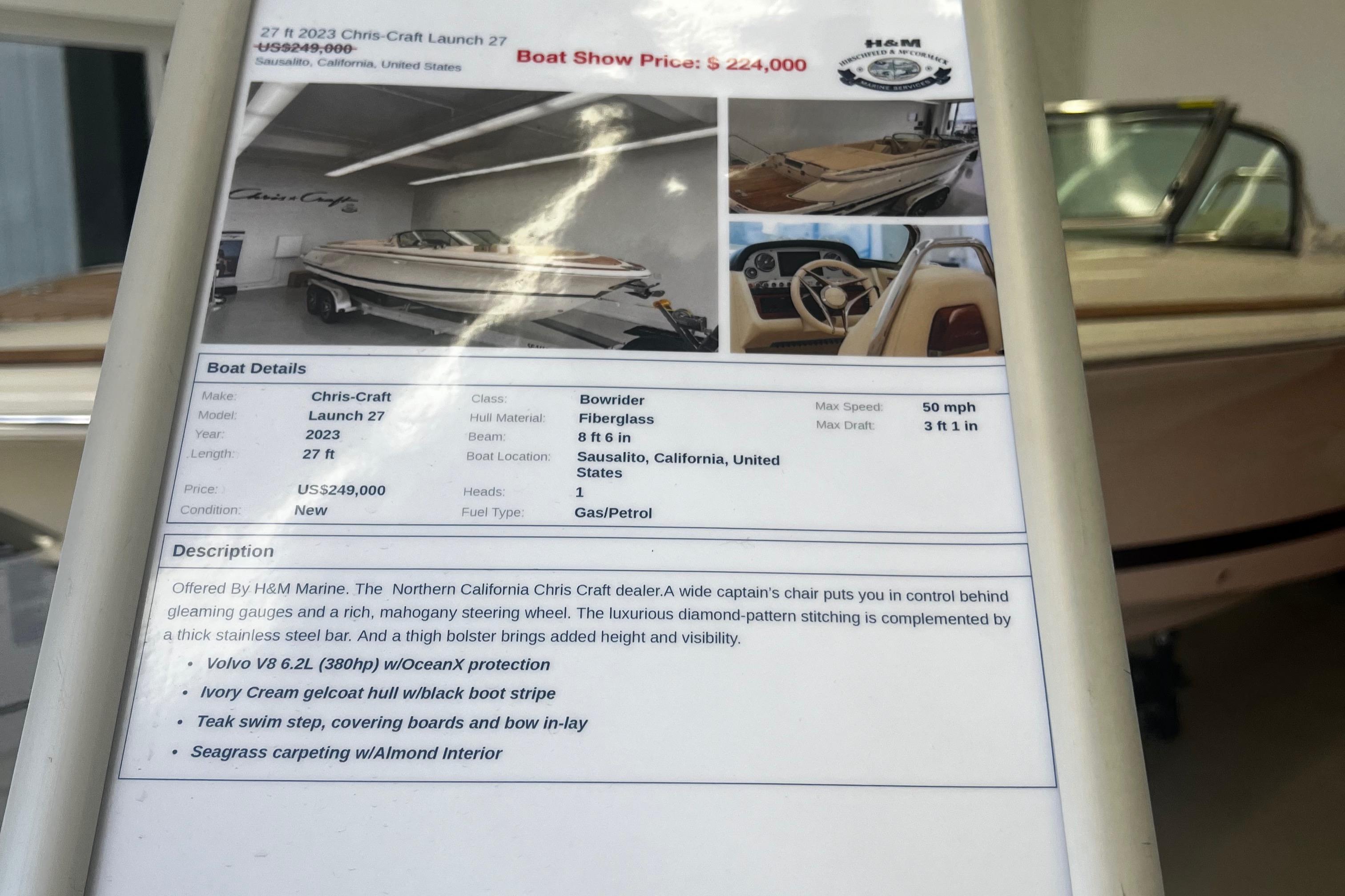 2023 Chris-Craft Launch 27 boat details and price display at a boat show.
