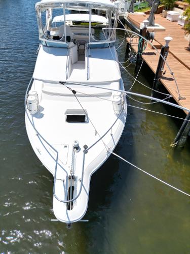 1992 Sea Ray 350 Express Bridge docked at a marina.