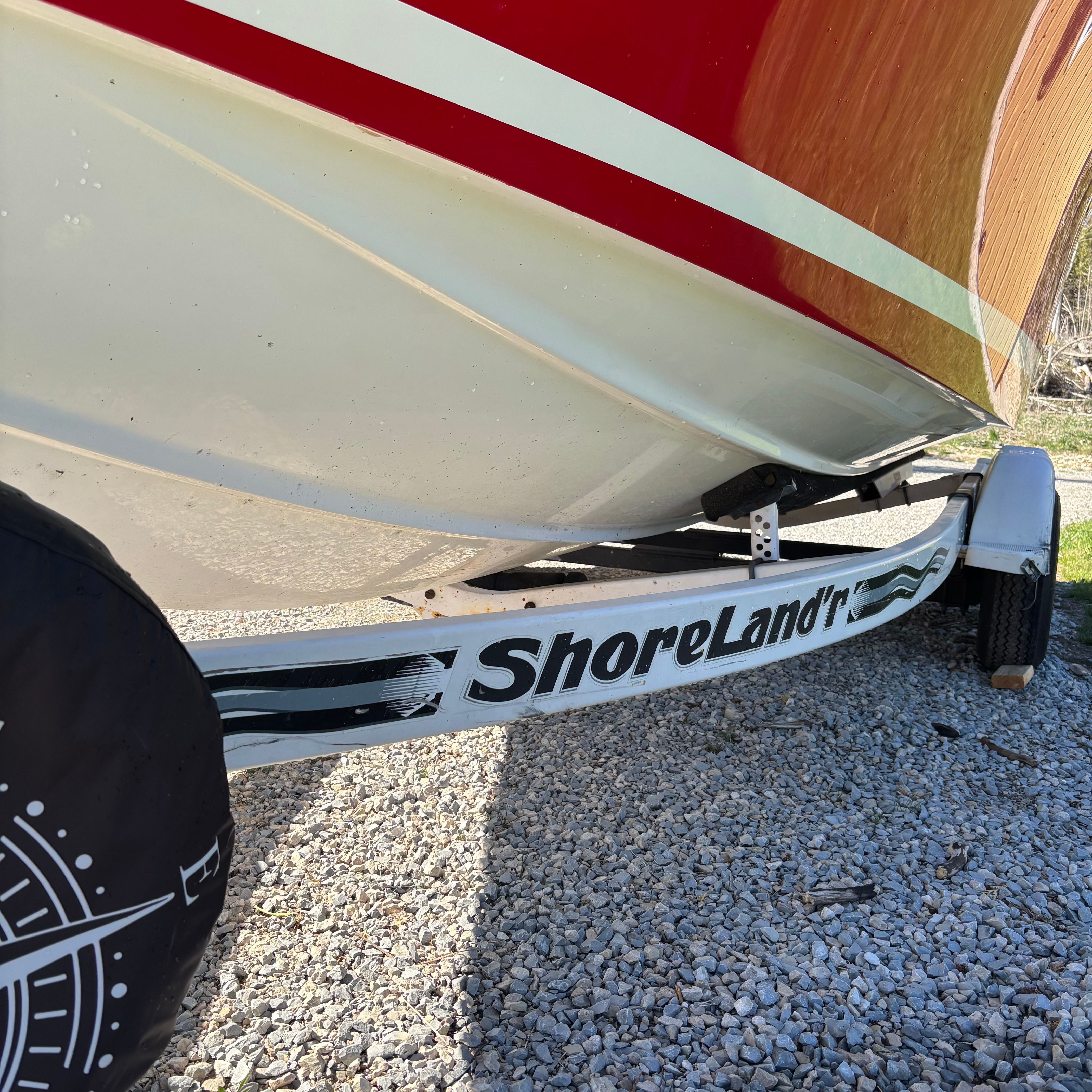 A 2003 Chris-Craft Launch 22 boat on a ShoreLand'r trailer.