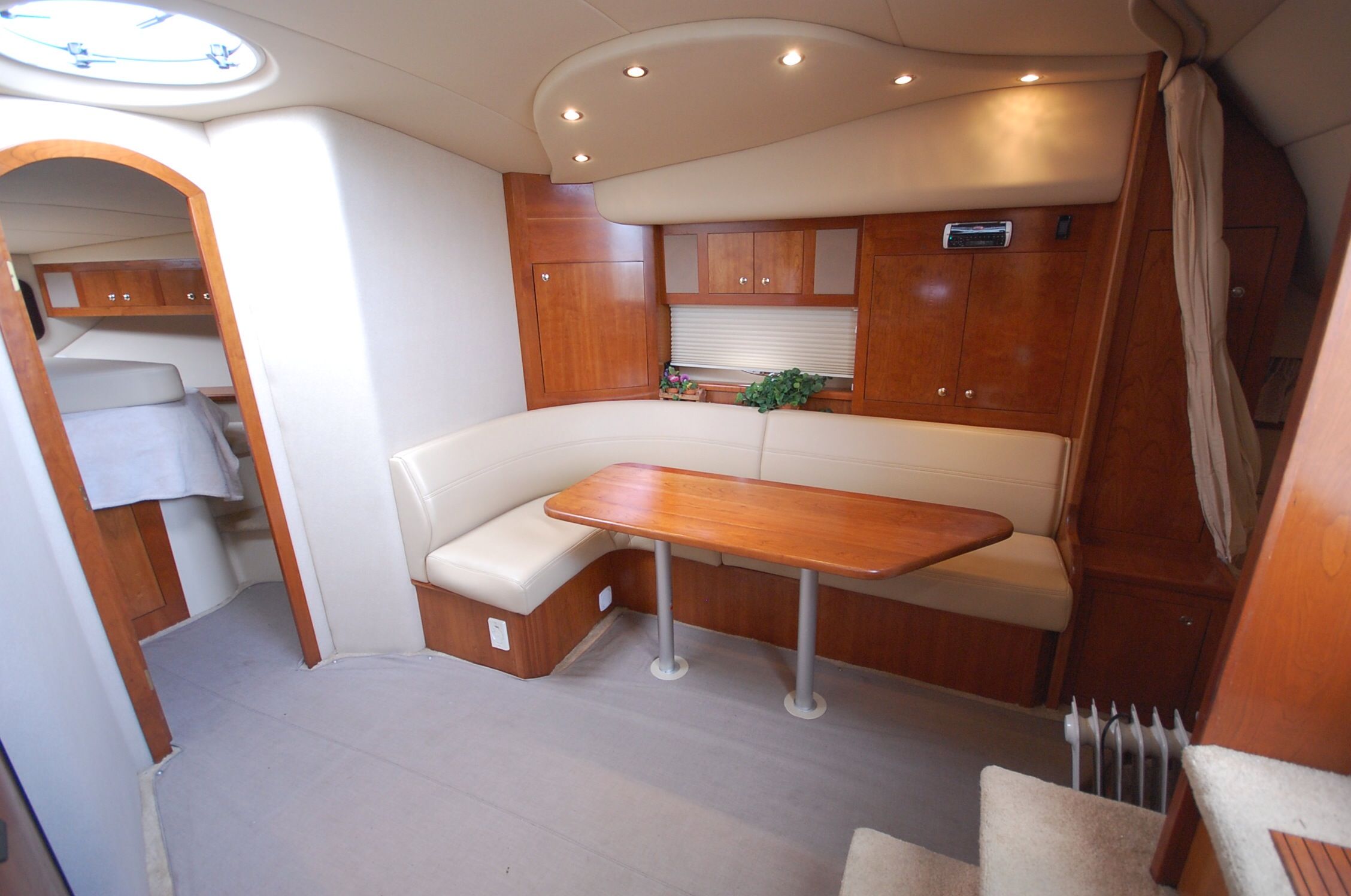 Interior of a 2004 Cruisers Yachts 3970 with wood furnishings and seating area.