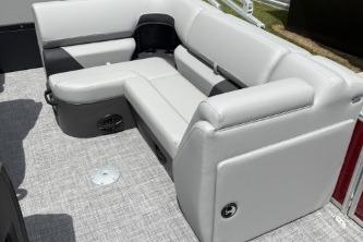 2026 Sun Tracker SportFish 20 DLX boat interior with gray seating and carpeted floor.