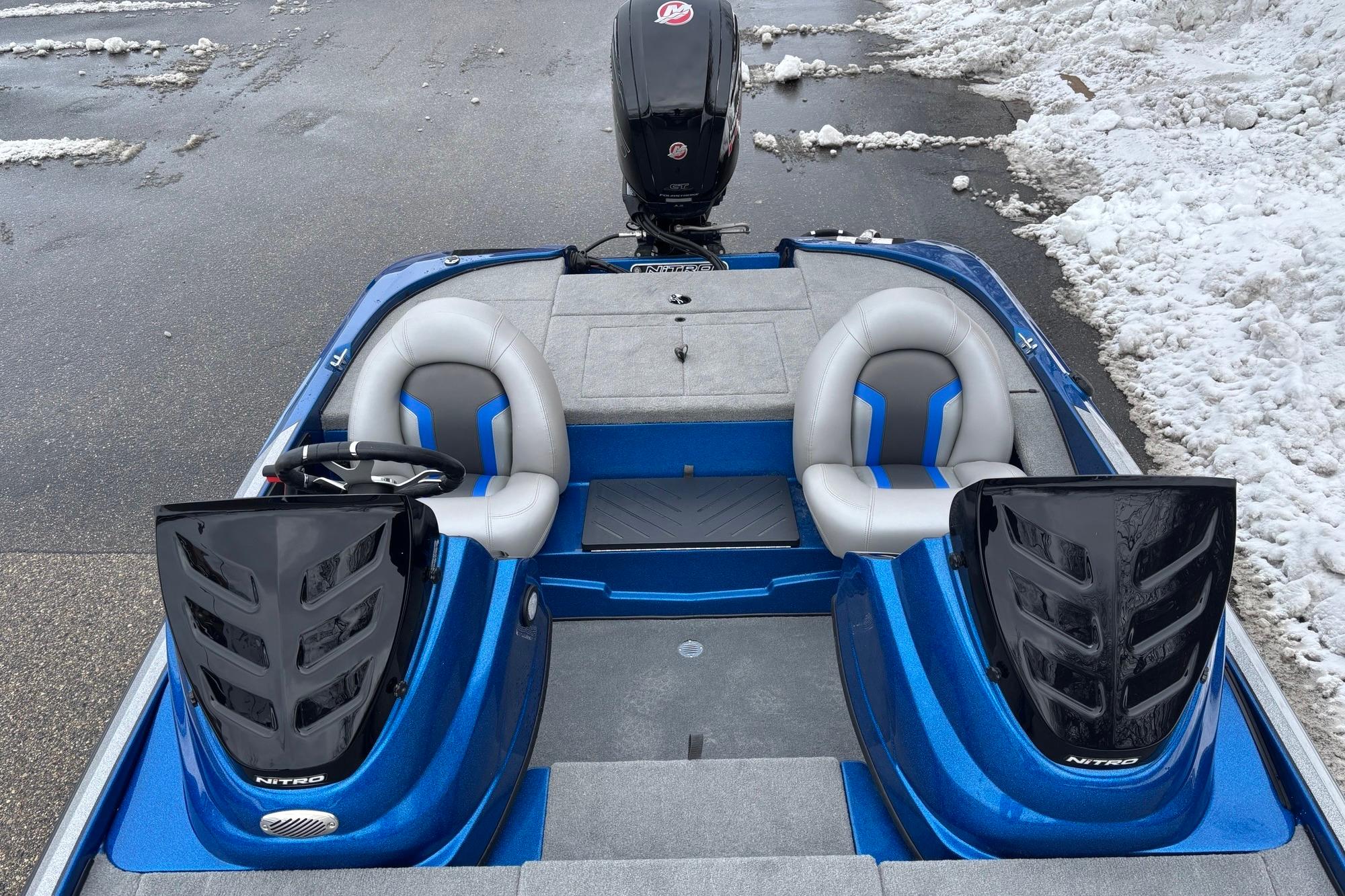 2026 Nitro Z17 boat with dual seats and sleek design on snowy pavement.