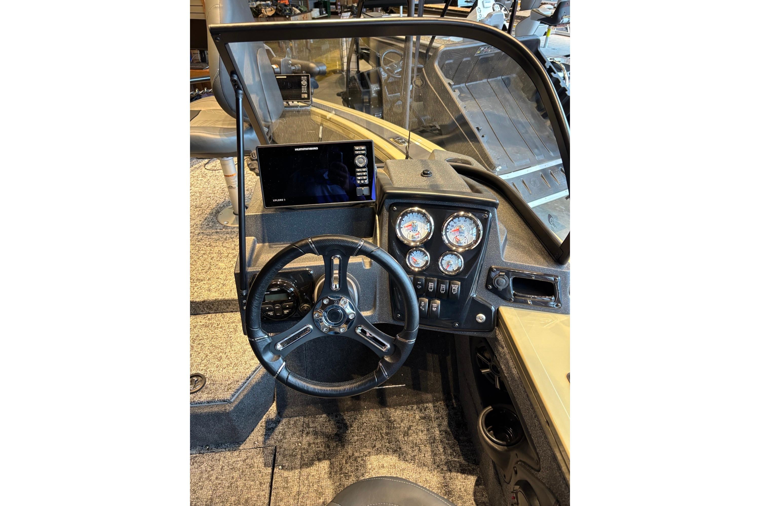 2026 Tracker Targa V-18 Combo boat dashboard with steering wheel and instrument panel.