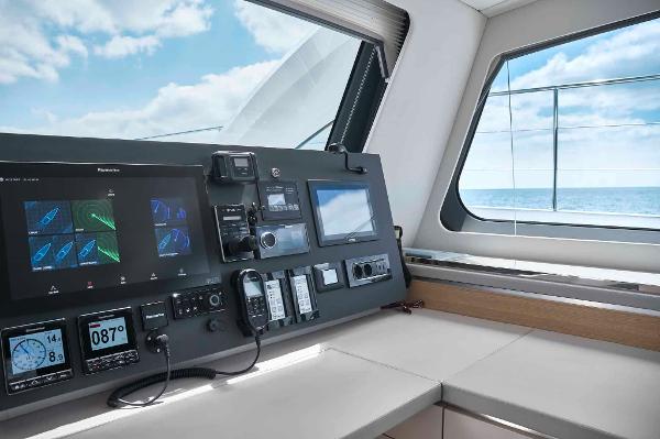 Control panel of 2025 Privilege Signature 580 yacht with ocean view.