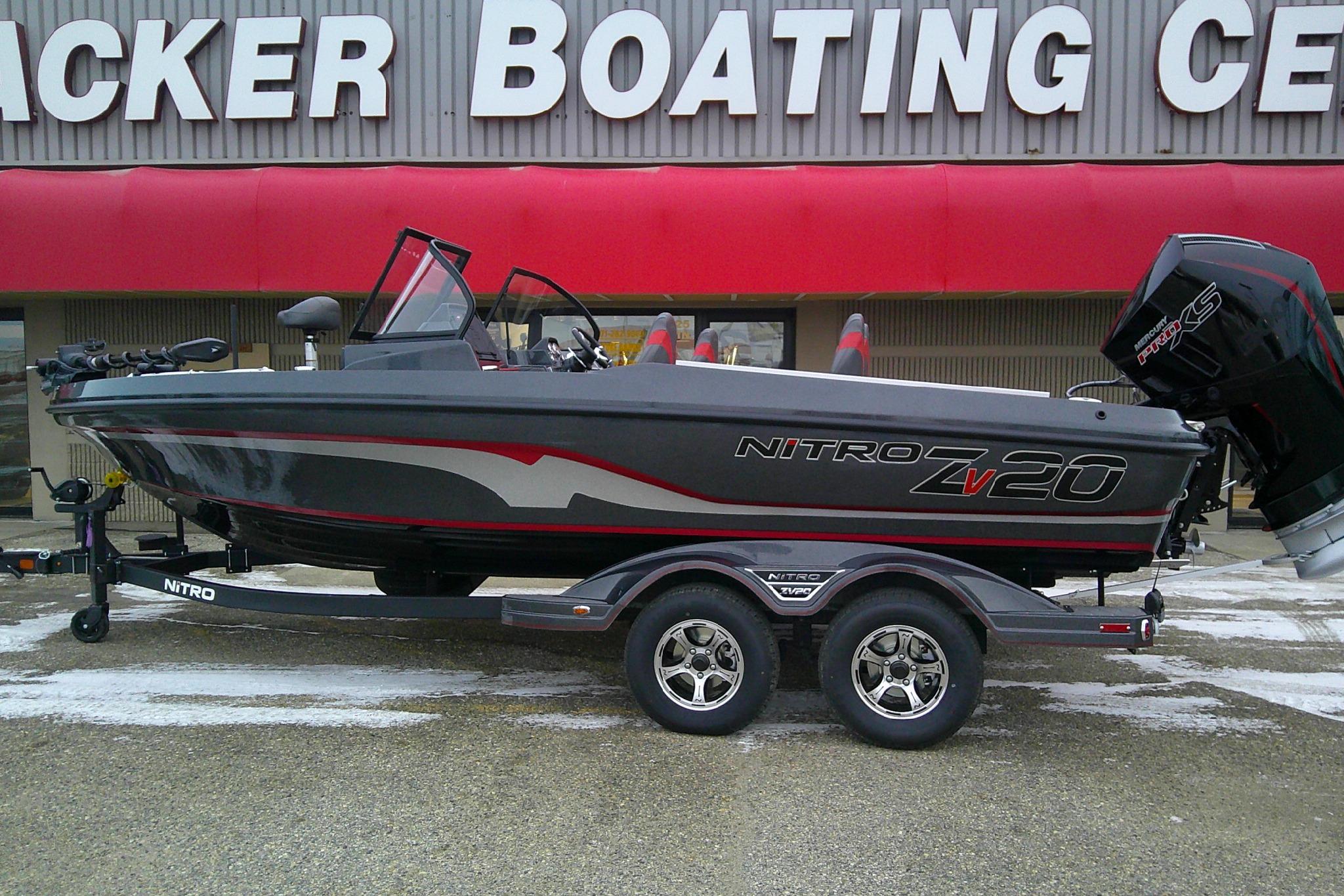 2026 Nitro ZV20 Pro boat on trailer outside boating center.