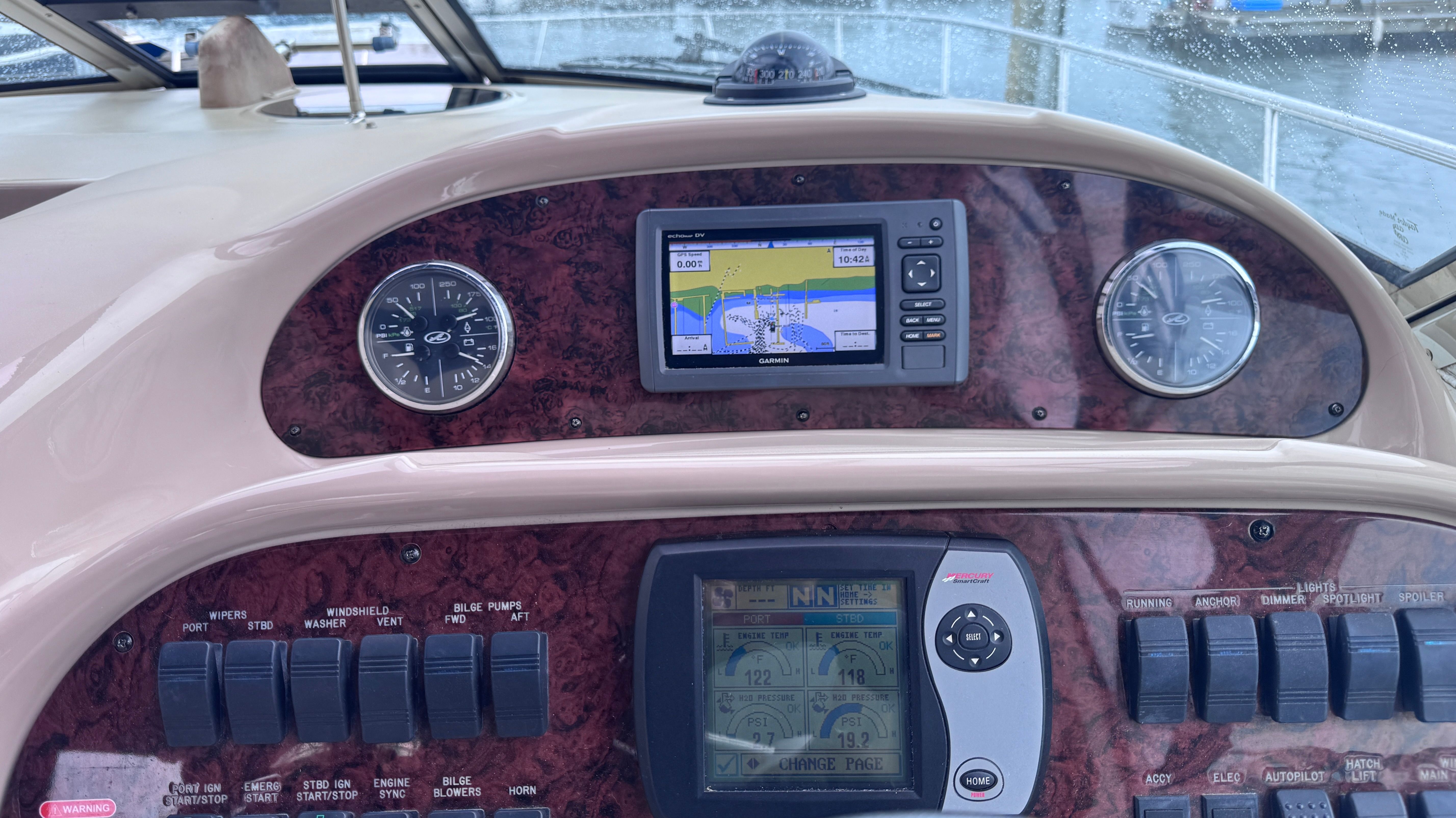 The dashboard of a 2003 Sea Ray 360 Sundancer with navigation system and instruments.