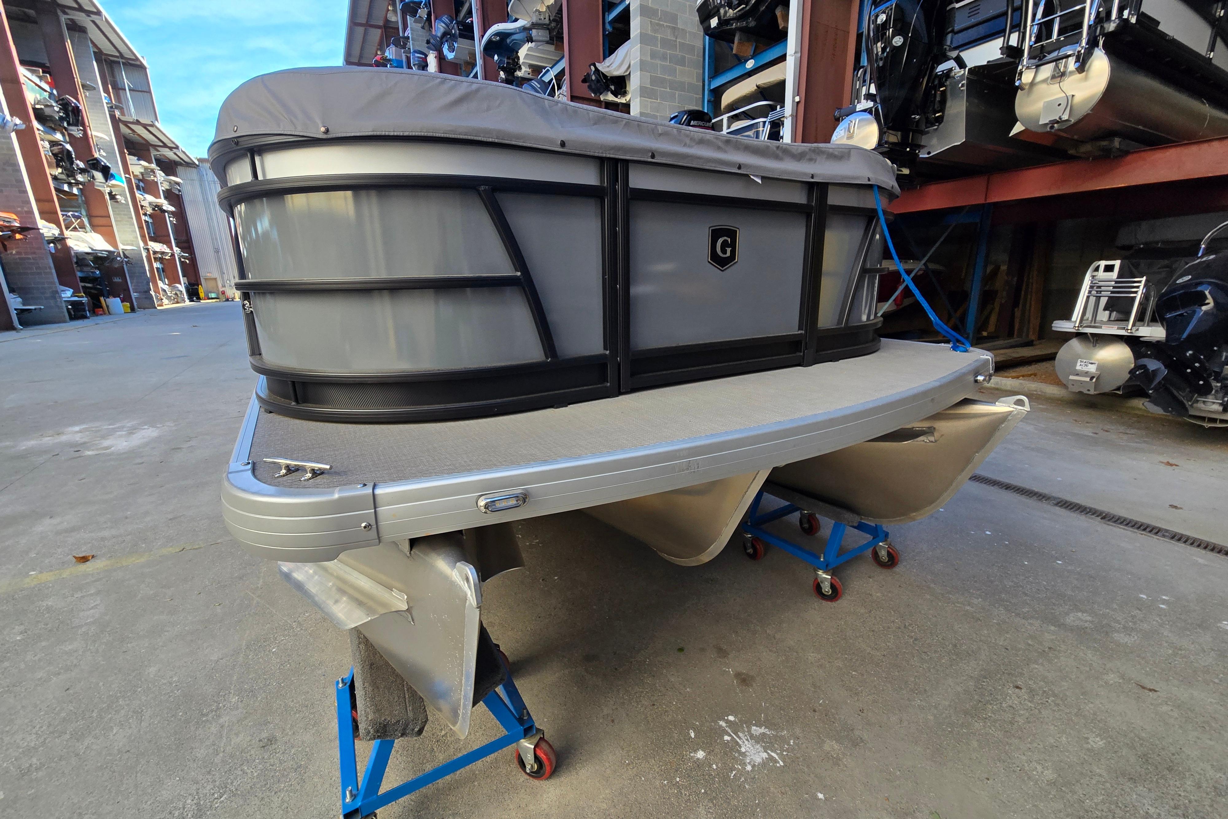 2024 Godfrey Sweetwater 2486 SB pontoon boat in storage facility.