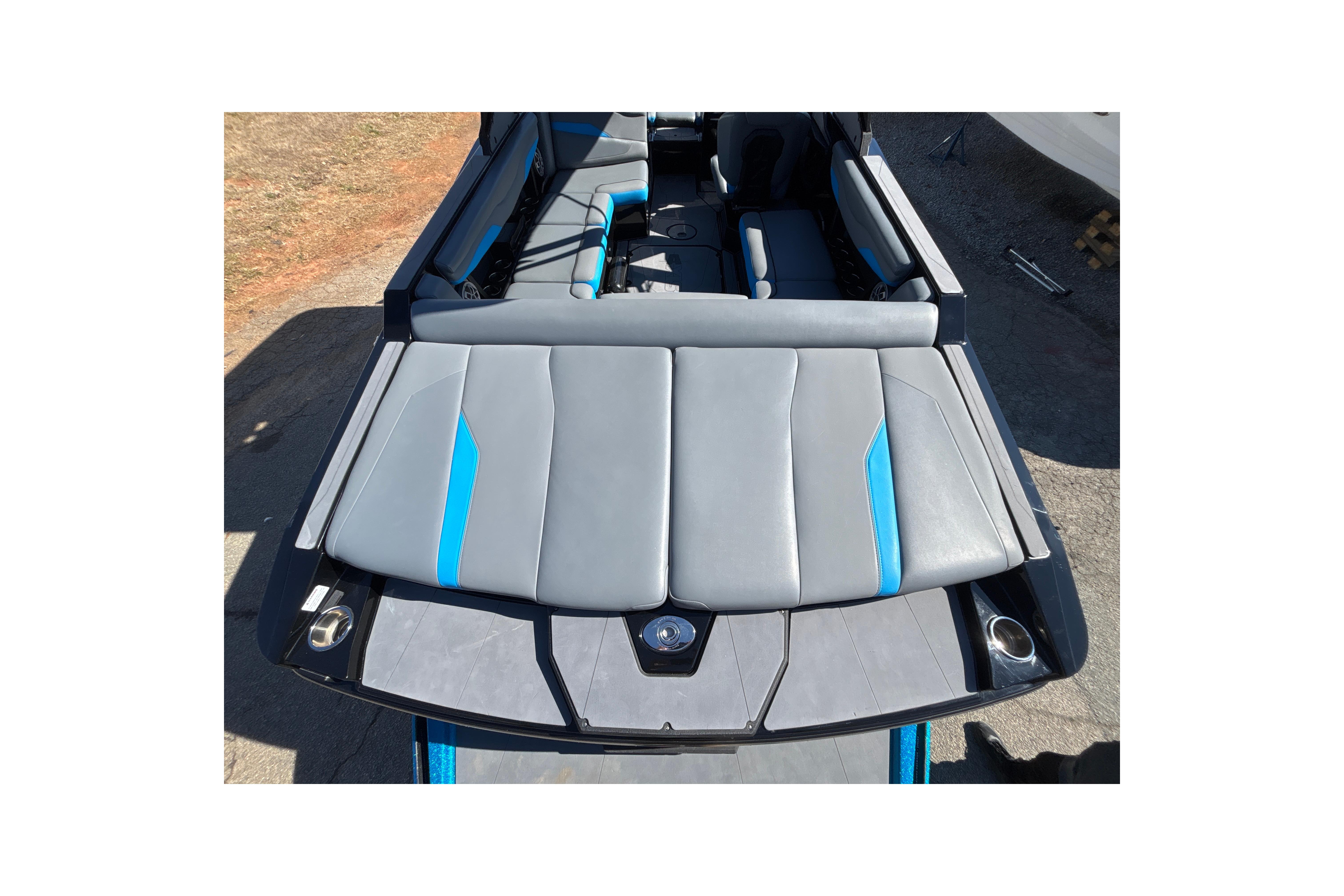 2023 Axis T220 boat interior with gray and blue seating, viewed from above.