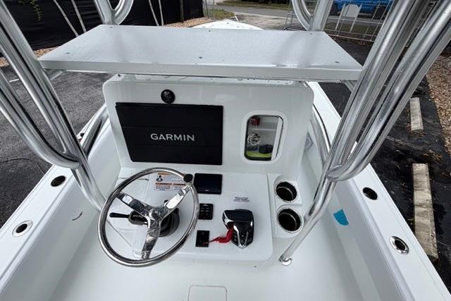 2025 Contender 26 Bay boat console with Garmin navigation system and steering wheel.