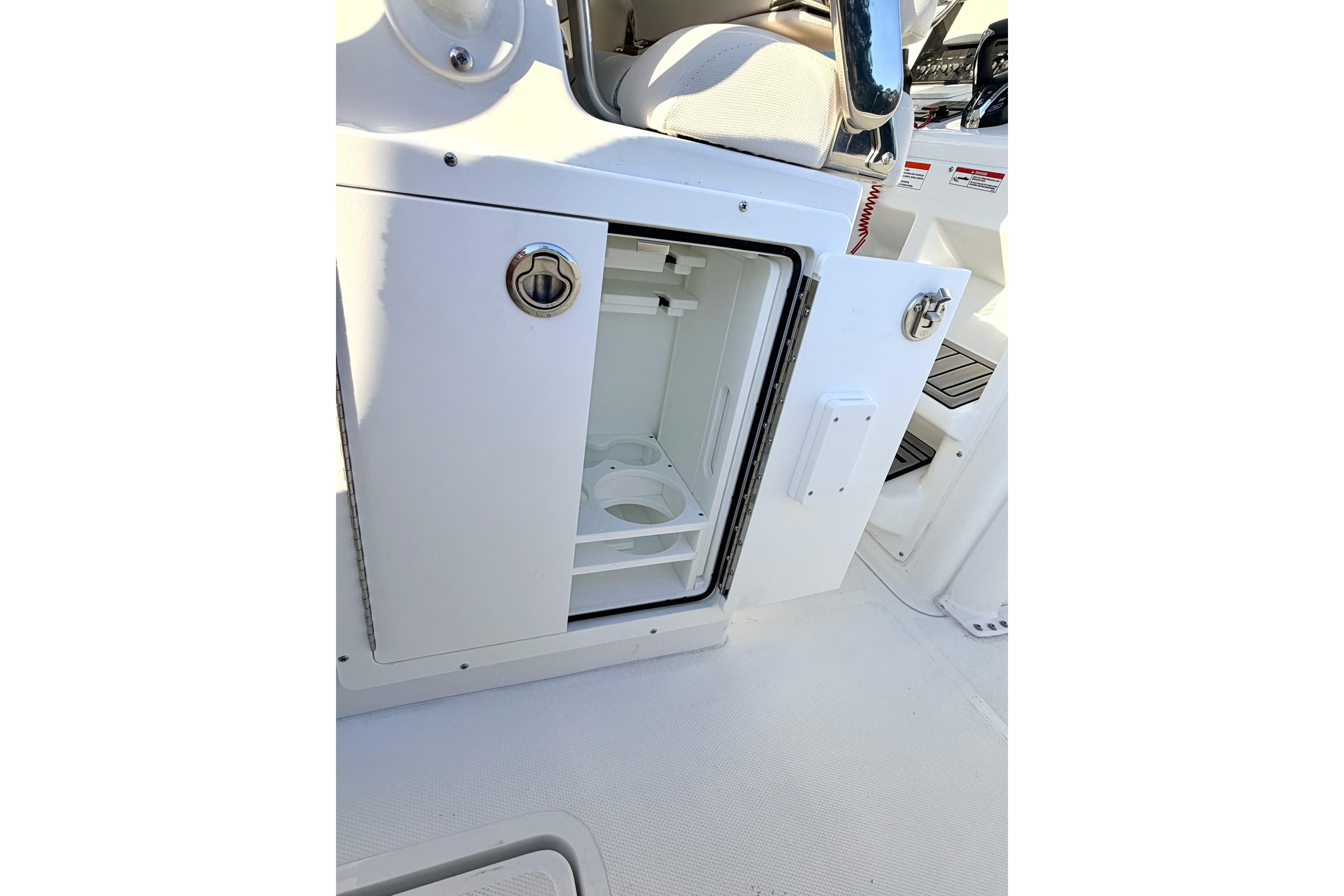 2026 Sea Hunt Ultra 275 Coffin Box interior storage compartment open.