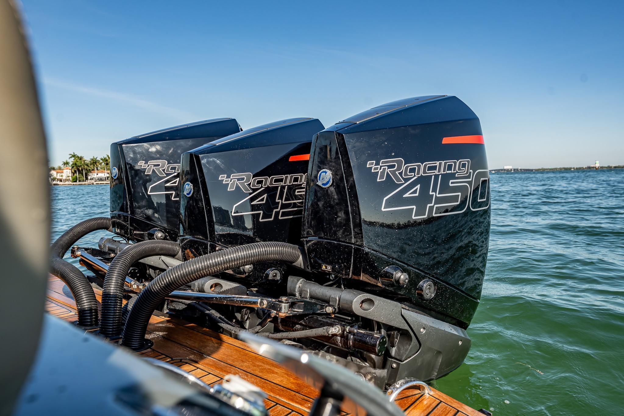 Triple Mercury Racing 450 engines on a 2023 Skipper-BSK 38NC boat in open water.