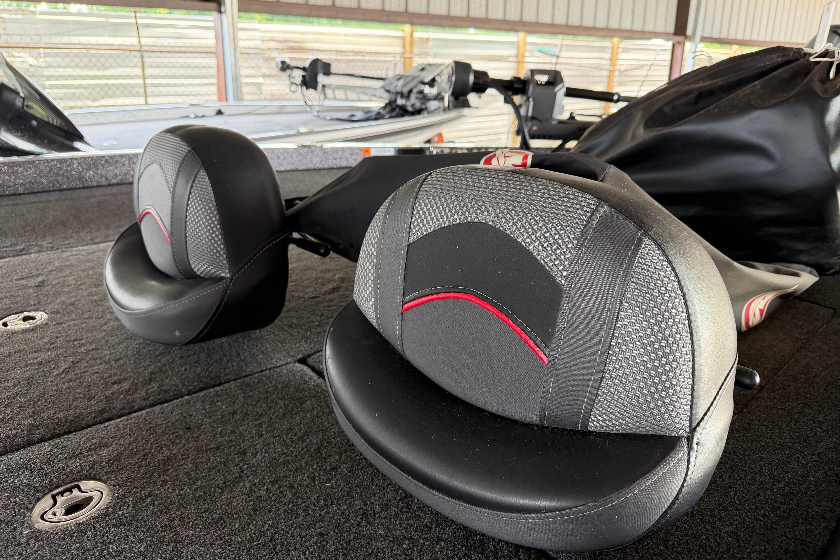 2020 Ranger Z520L boat seats with black and red accents in a covered area.