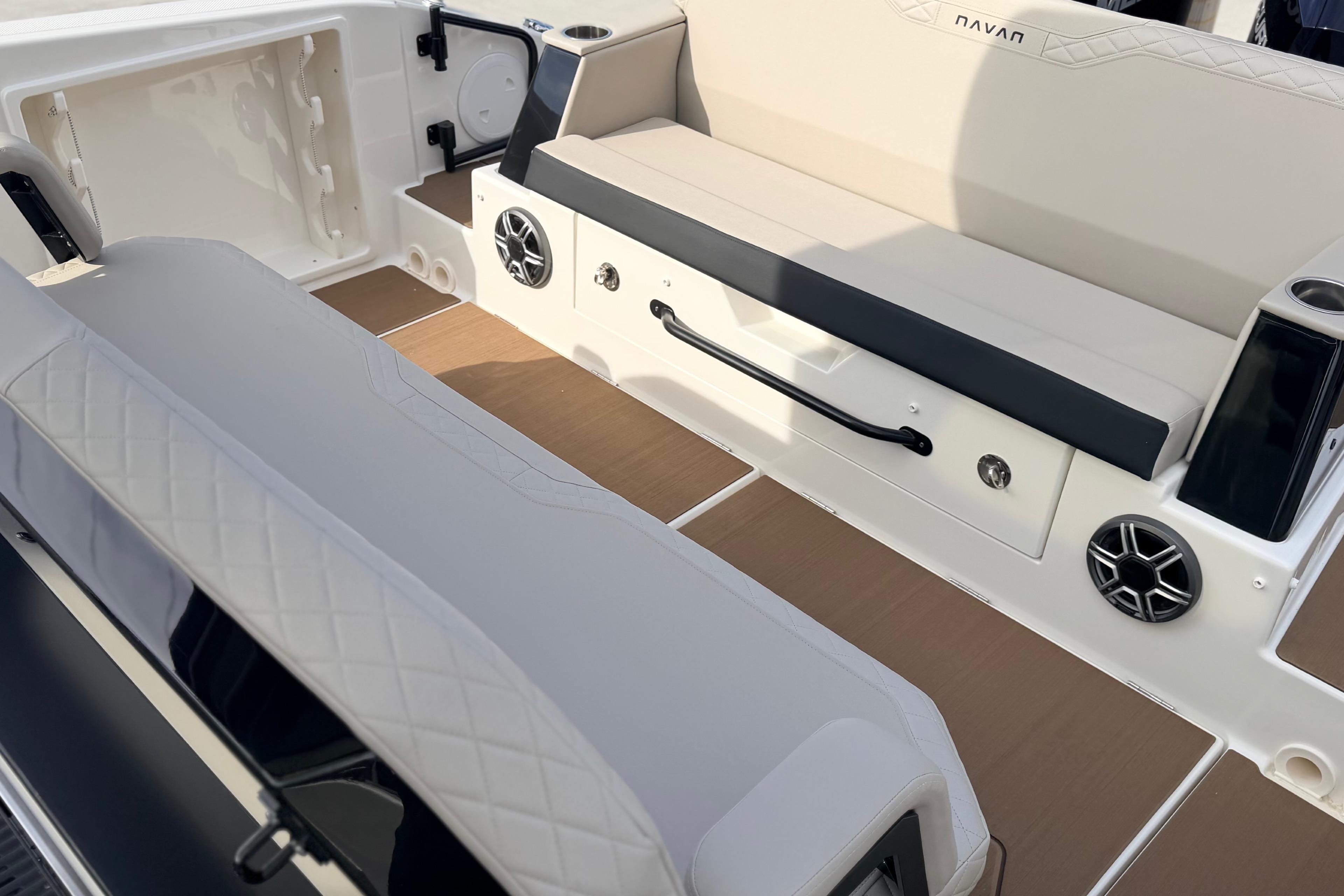 Interior of 2026 Navan S30 boat featuring seating and built-in speakers.