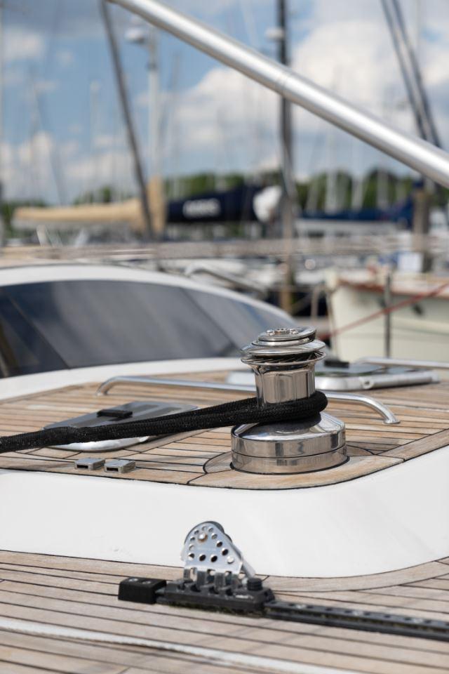 Close-up of 1991 Devonport Thomas Custom 67 yacht deck with winch and rope.