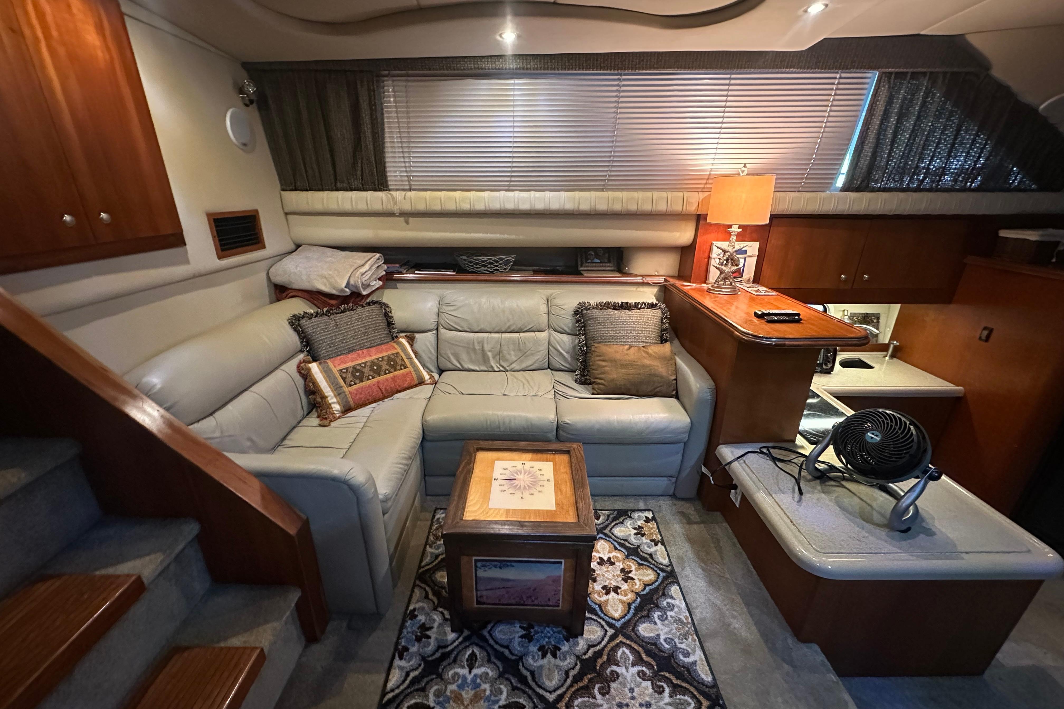 Luxurious 2005 Cruisers Yachts 375 Motoryacht interior with cozy seating and elegant decor.