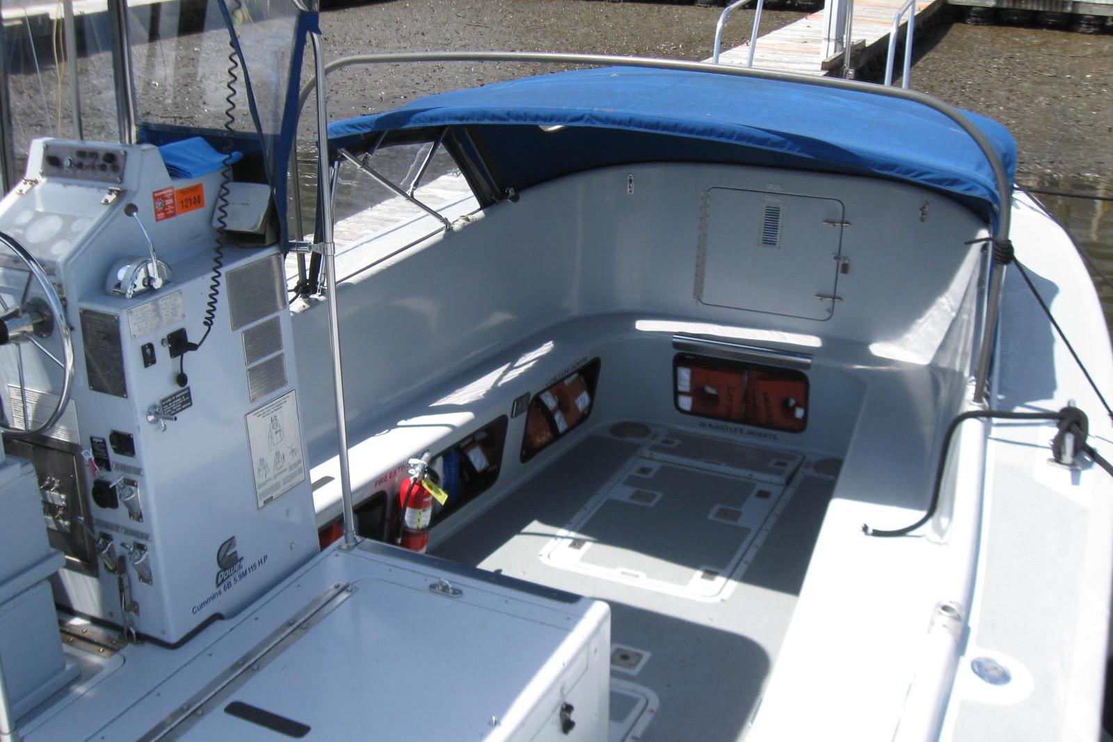 1994 Willard US Navy boat interior with blue canopy and control panel.