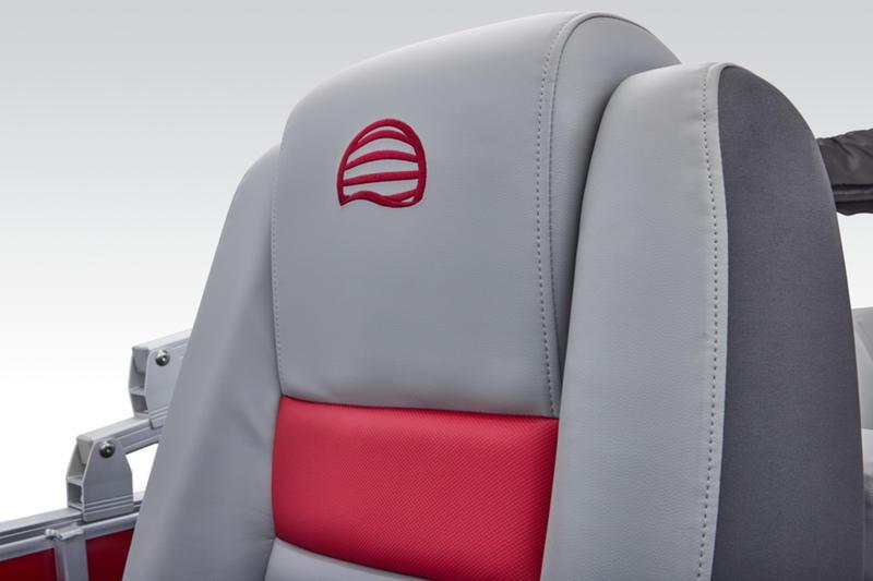 2026 Sun Tracker Party Barge 22 DLX seat with red and gray upholstery.