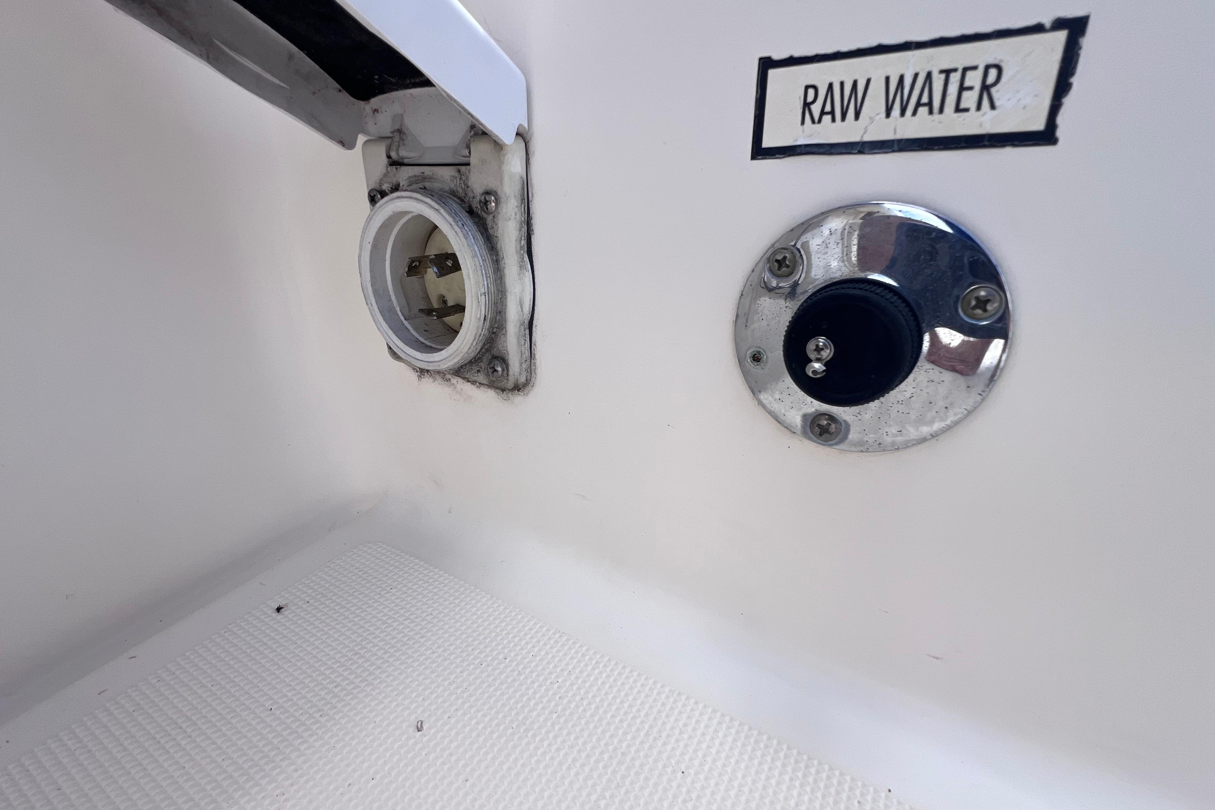 2004 Pursuit 2870 Walkaround boat raw water inlet and outlet fittings.