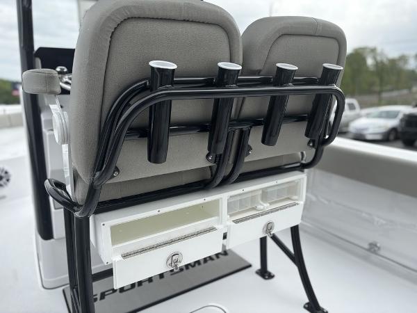 2025 Sportsman Open 232 boat seats with rod holders and storage compartments.