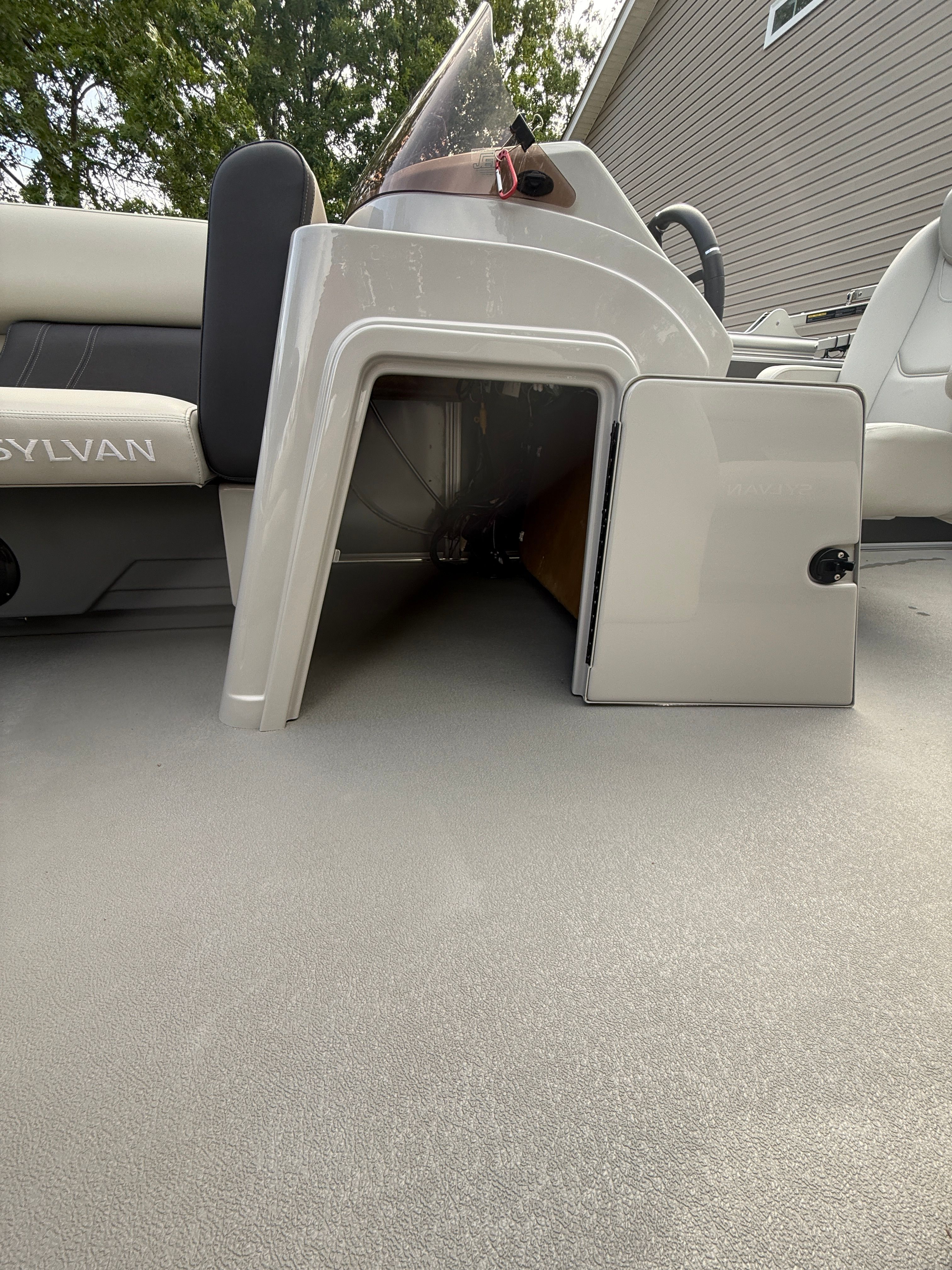 Sylvan Mirage Fish 8520 Party Fish 2025 with open storage compartment.