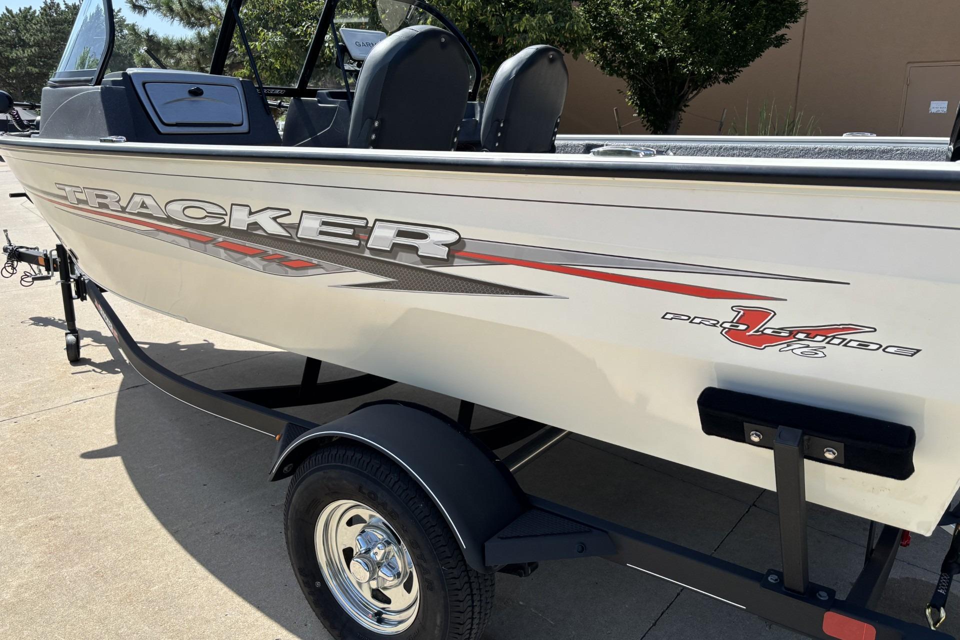 2022 Tracker Pro Guide V-16 SC boat on trailer, side view.