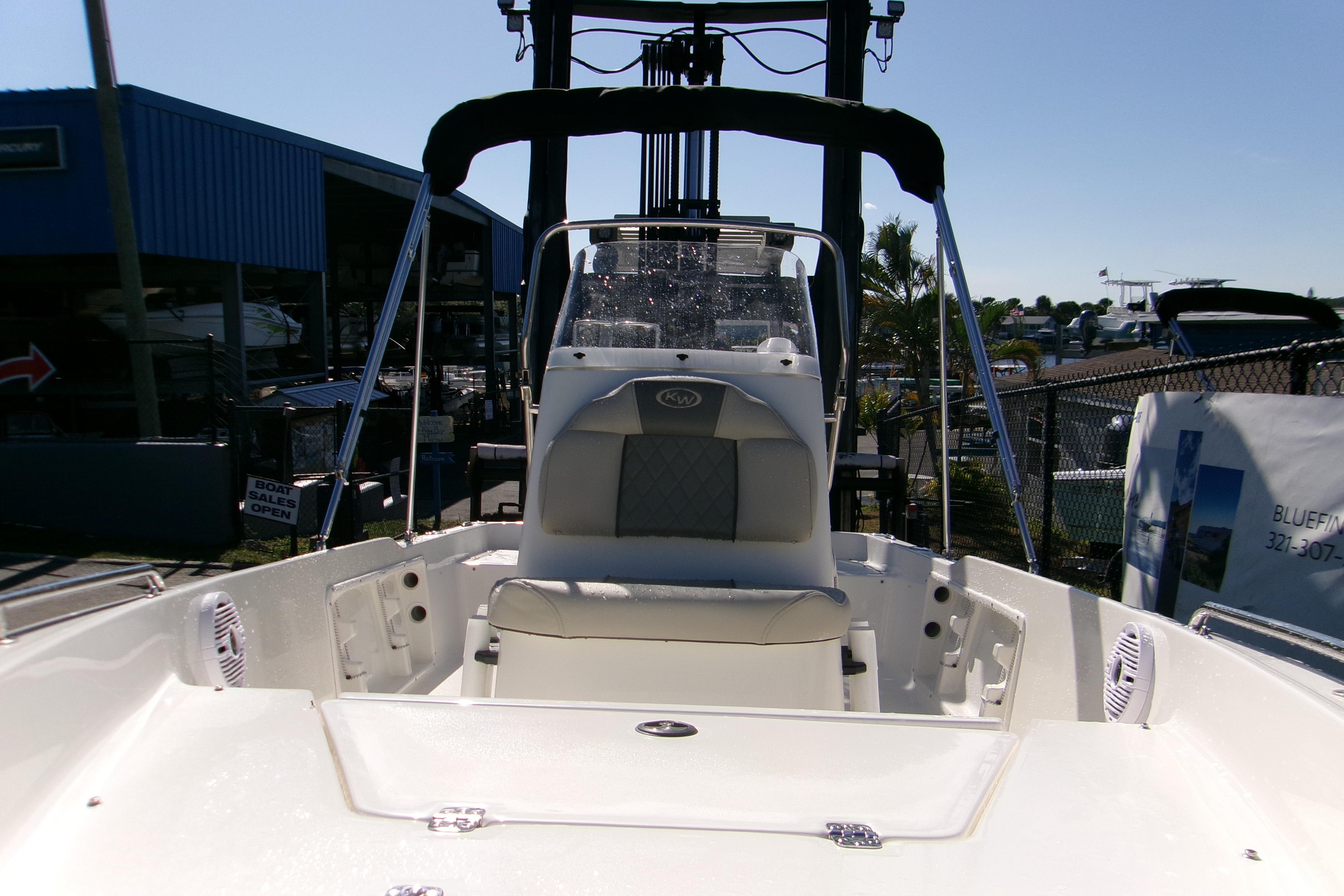 2026 Key West 1720 Center Console boat at a marina, showcasing seating and console.