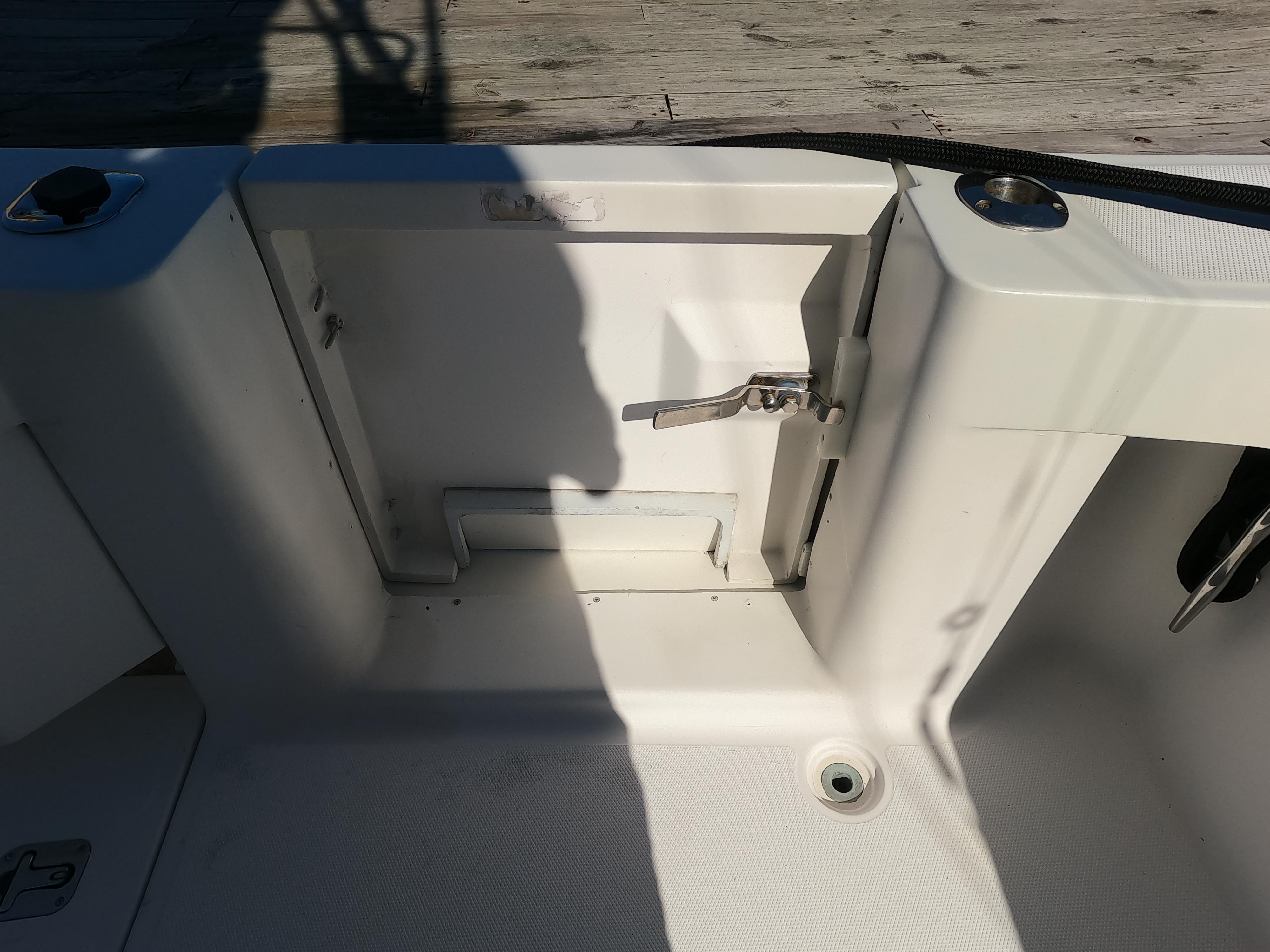 2002 Luhrs 34 Convertible boat deck with storage compartment.