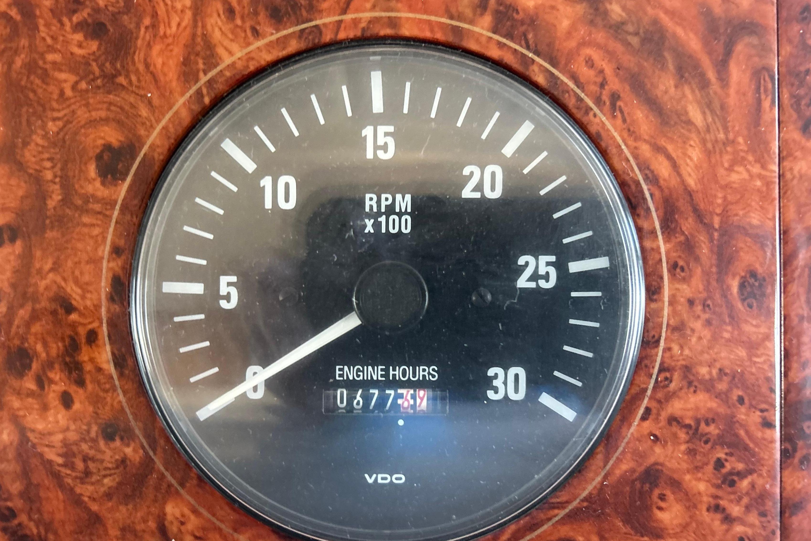 Tachometer of 1998 Bayliner 5788 Pilot House Motoryacht showing RPM and engine hours.