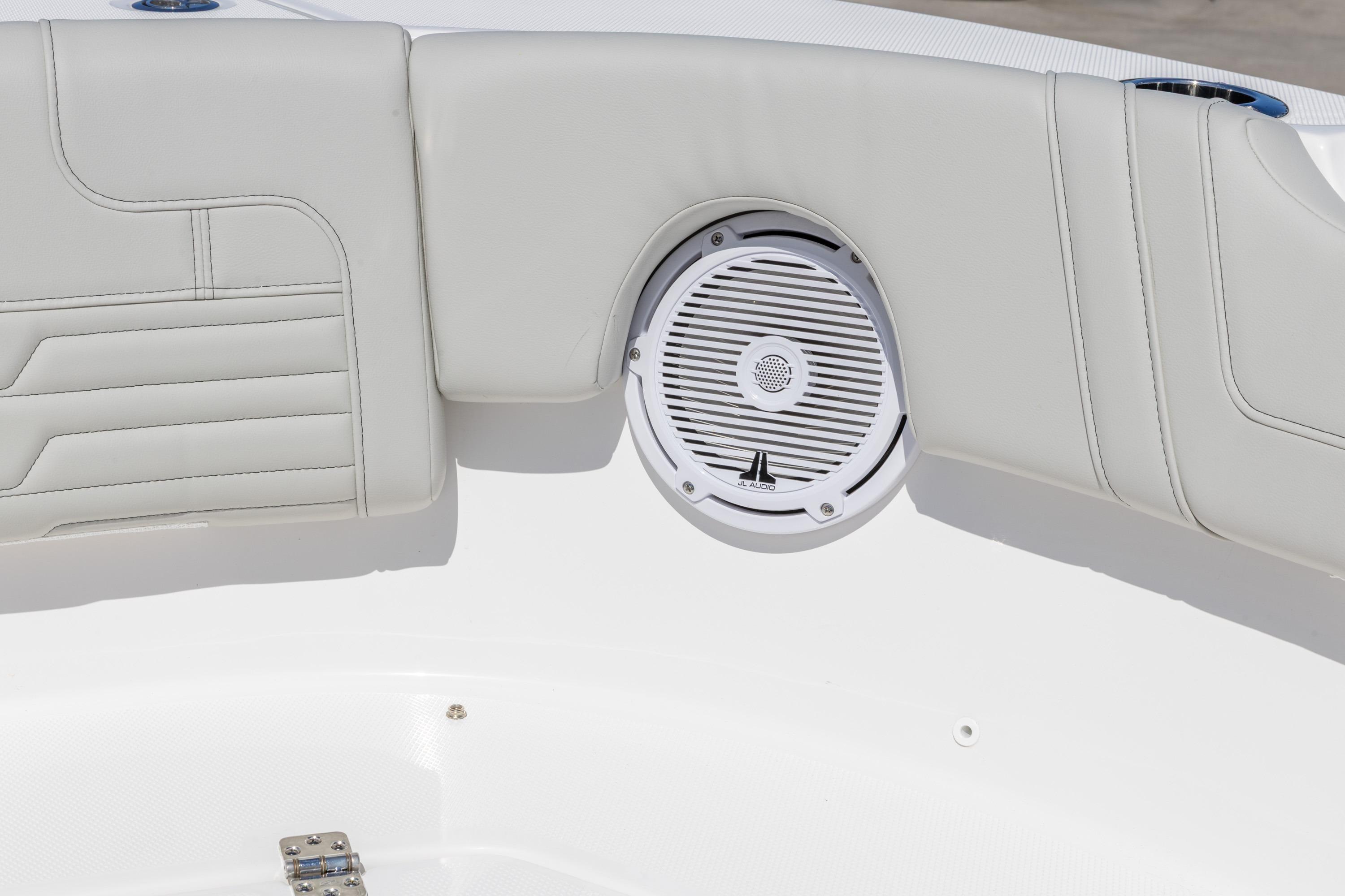 2026 Edgewater 248CX Crossover boat interior with speaker and cushioned seating.