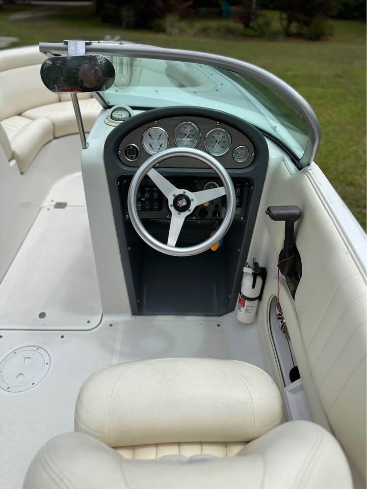 2001 Chris-Craft Launch 22 boat interior with steering wheel and dashboard gauges.
