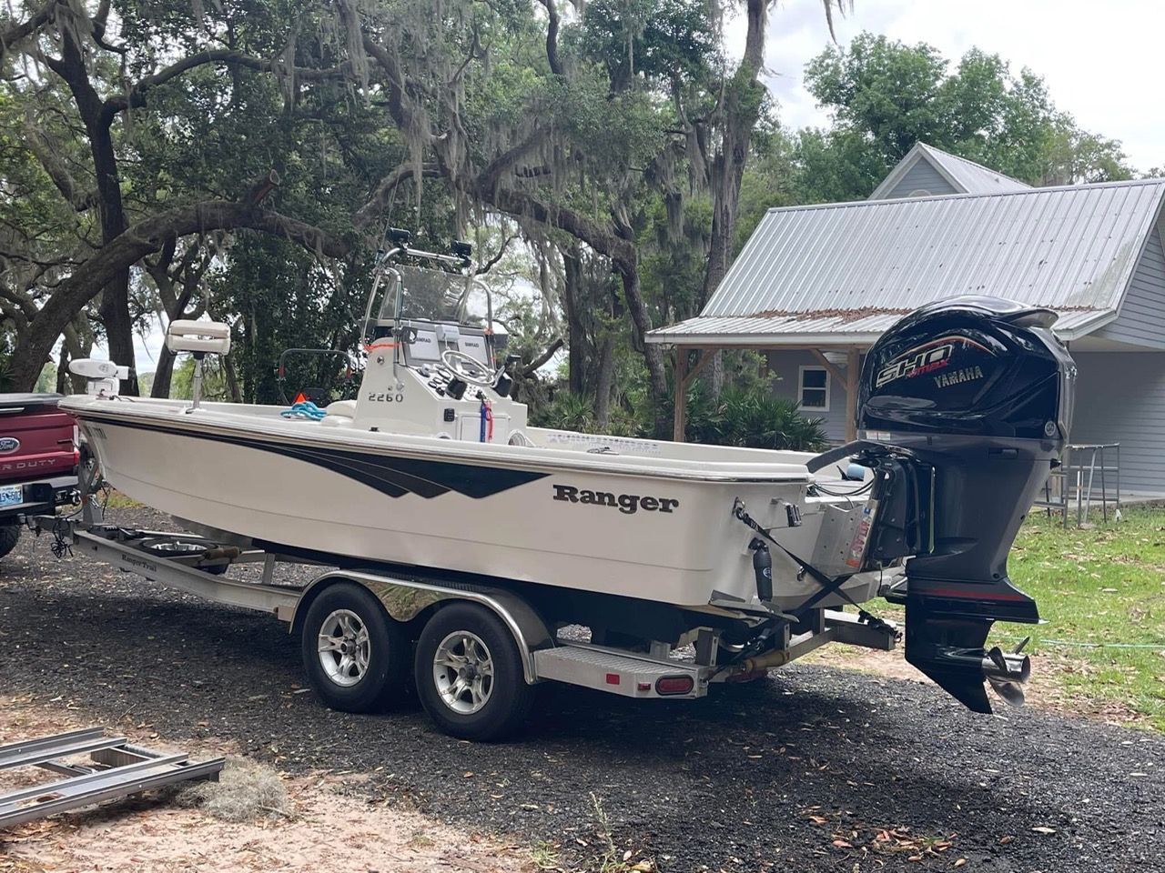2018 Ranger 2260 Bay Ranger boat on trailer outdoors.