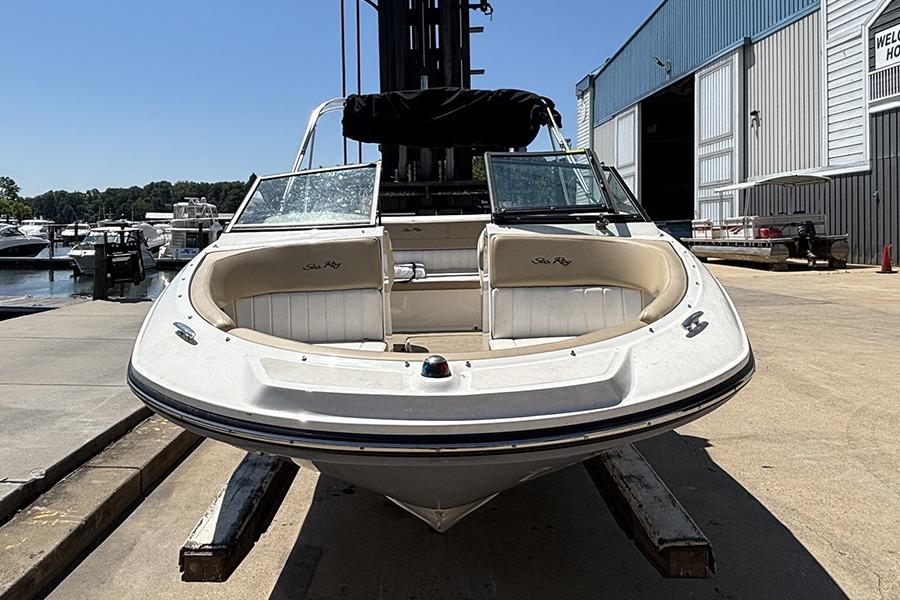 2018 Sea Ray SPX 190 boat docked at a marina, front view.