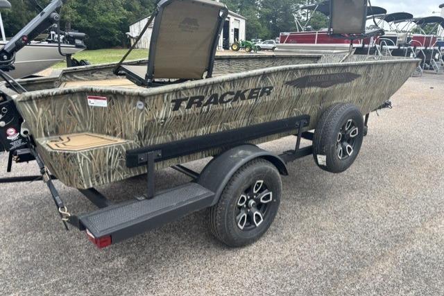 2026 Tracker Grizzly 1650 T Prairie Wings Edition boat on trailer, camo design.