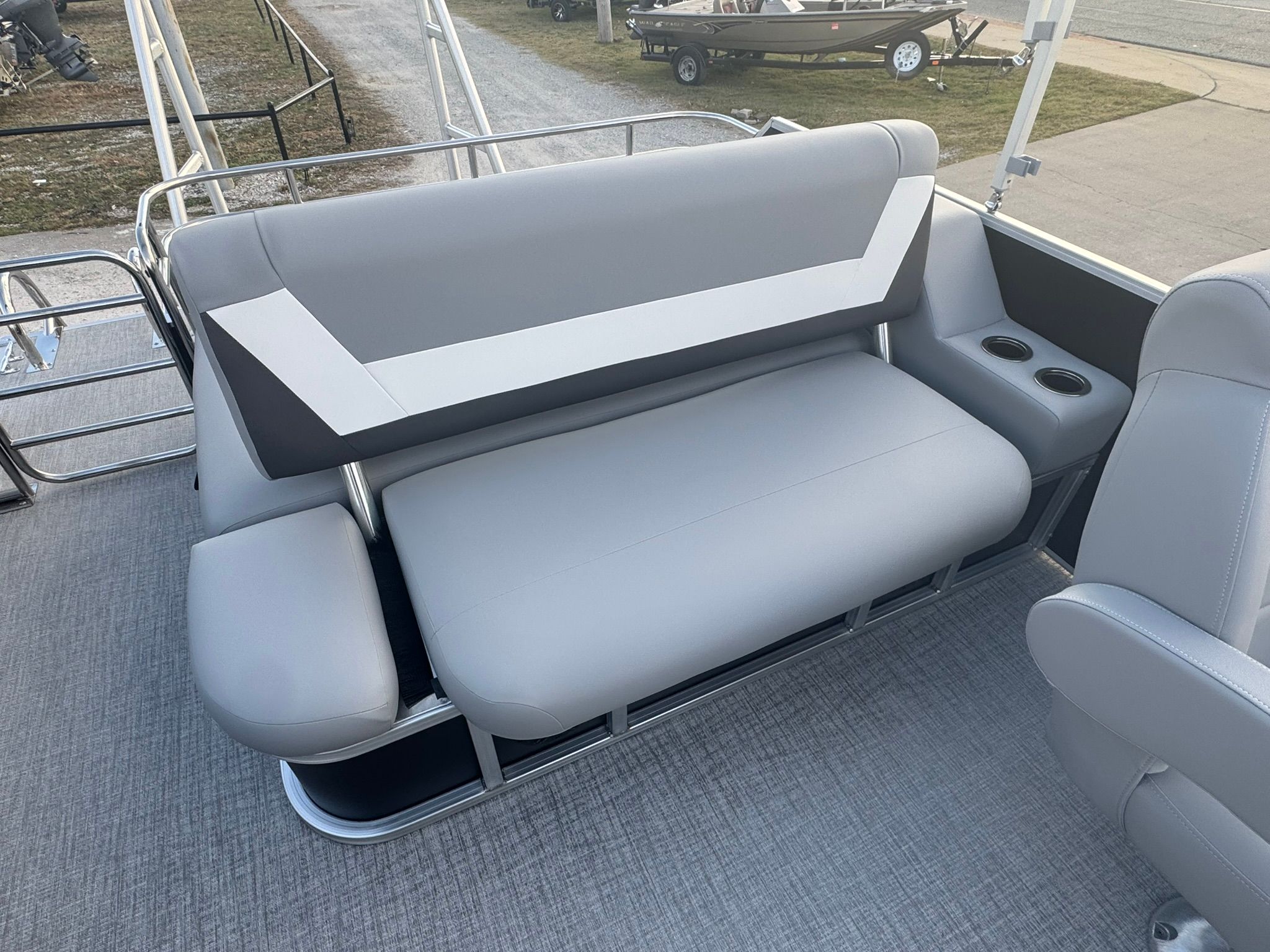 2026 Landau 23 Island Breeze boat seat with gray upholstery.