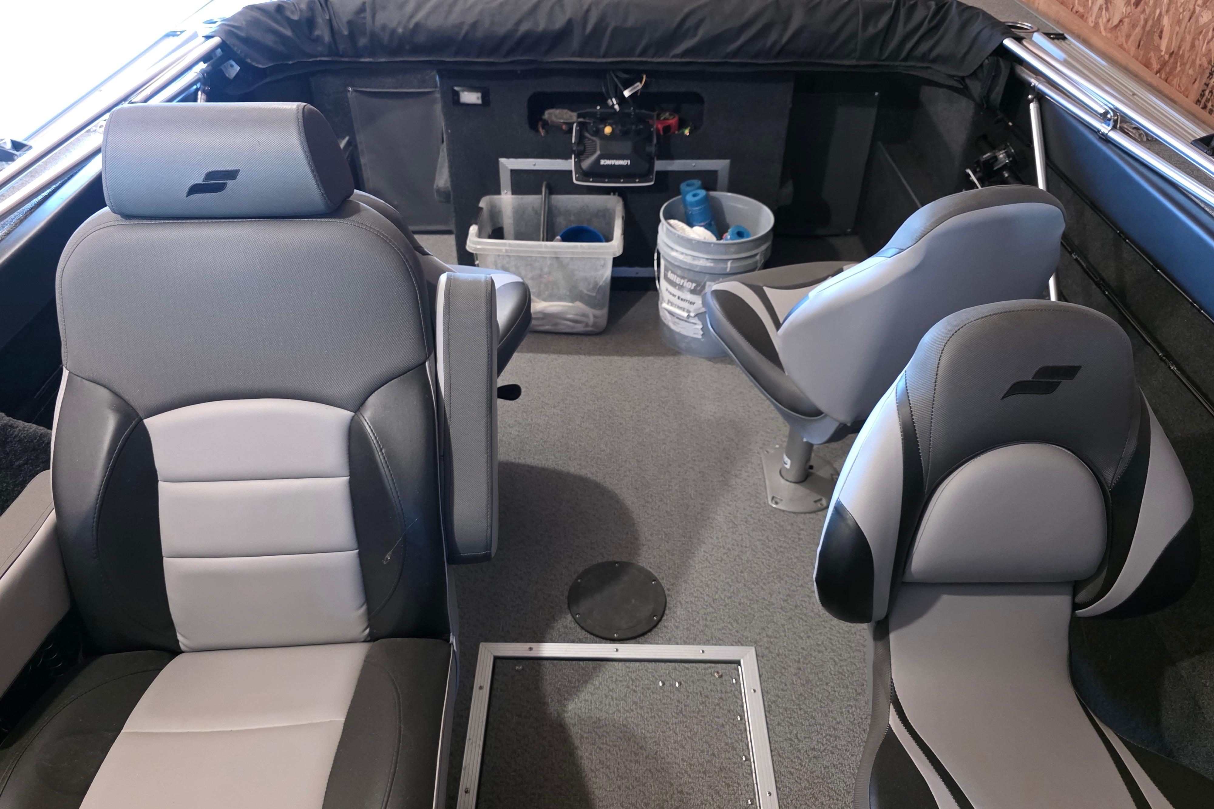 Interior of a 2022 Starweld Fusion Pro 20 DC boat with gray seating and storage compartments.