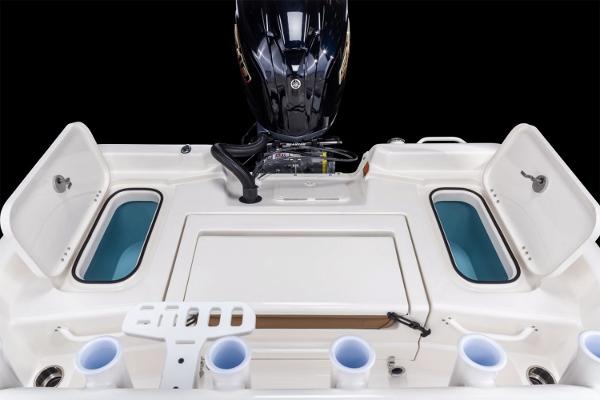 Manufacturer Provided Image: 2026 Skeeter SX2350 boat with open storage compartments and motor, showcasing fishing amenities.