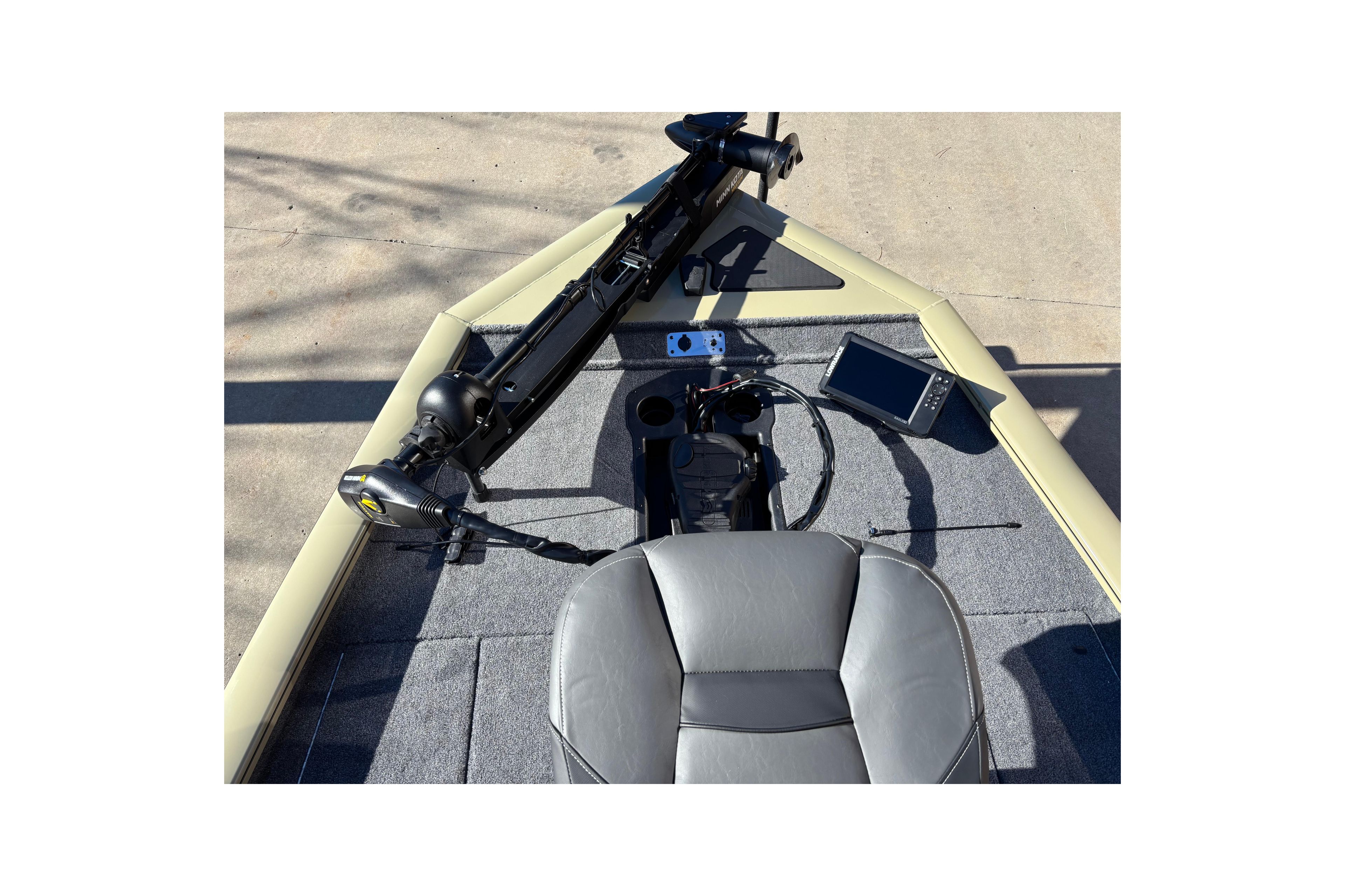 2026 Tracker Pro Team 195 boat interior with steering console and navigation equipment.