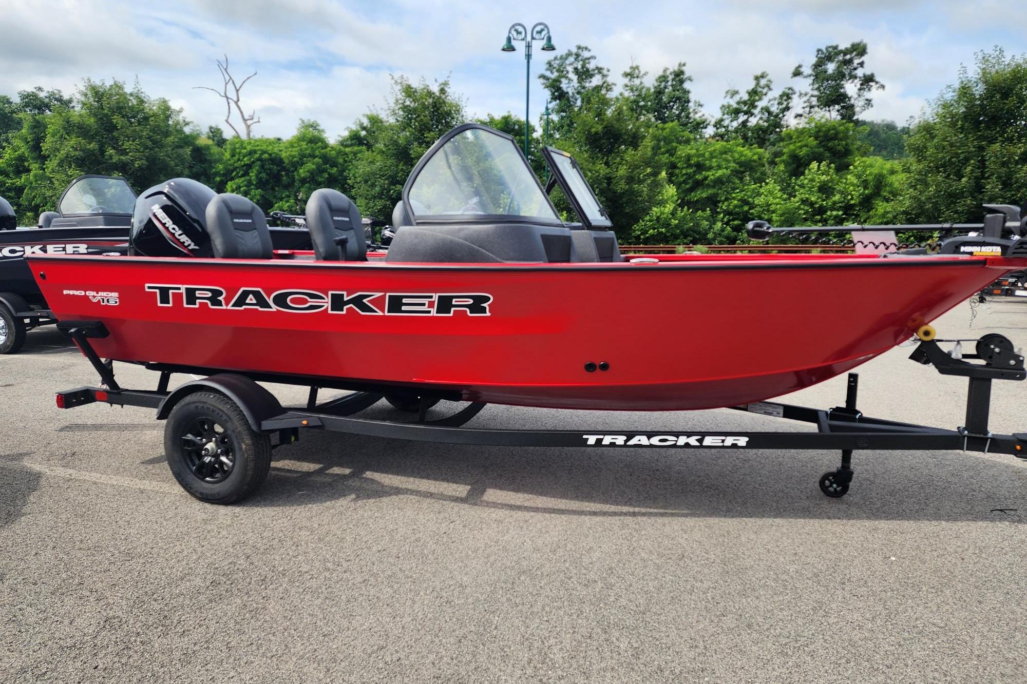 2026 Tracker Pro Guide V-16 WT boat in vibrant red on a trailer.