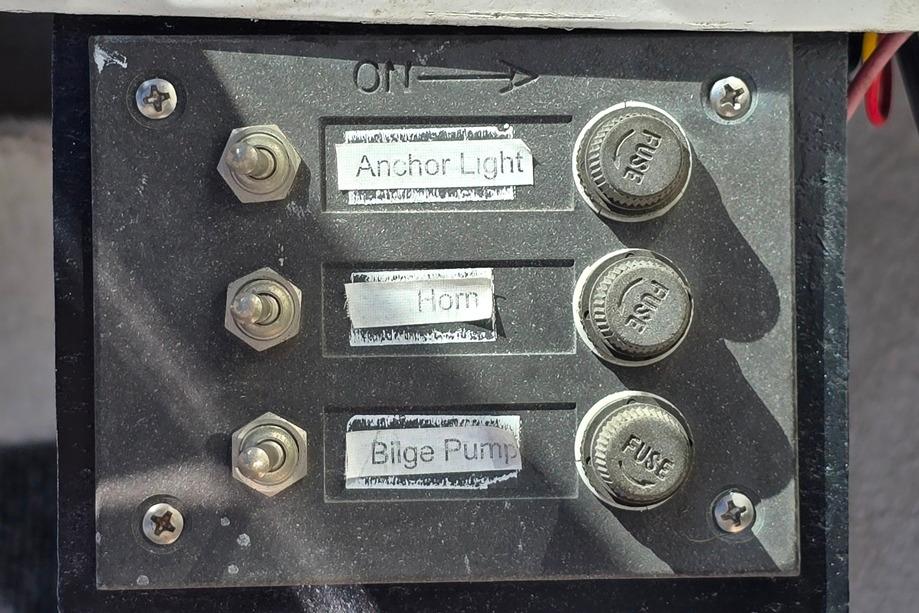 Control panel of a 1971 Jupiter 15' Tri Hull boat with labeled switches.