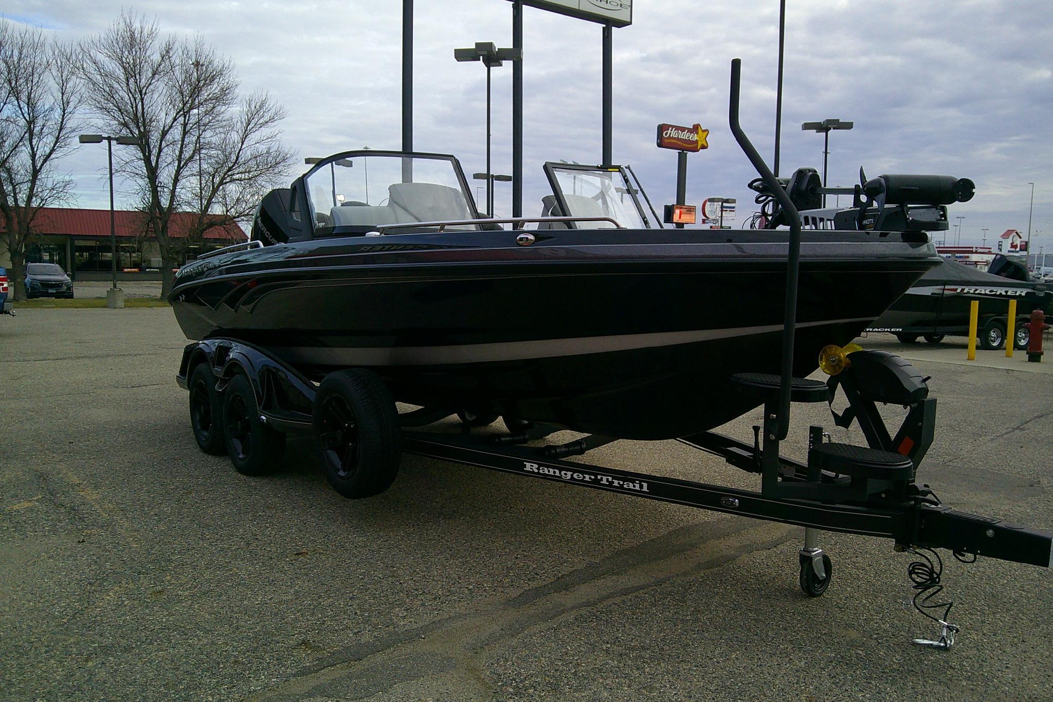 2026 Ranger 620FS Pro boat on trailer in parking lot, overcast sky.
