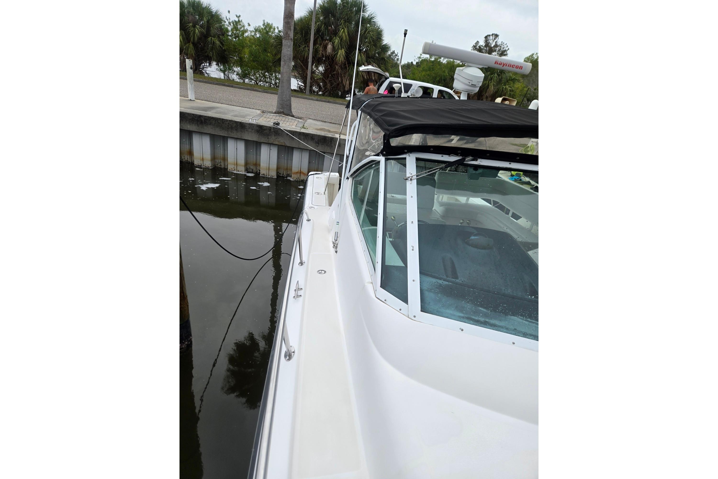 2002 Tiara Yachts 3500 Open docked, showcasing sleek design and waterfront setting.