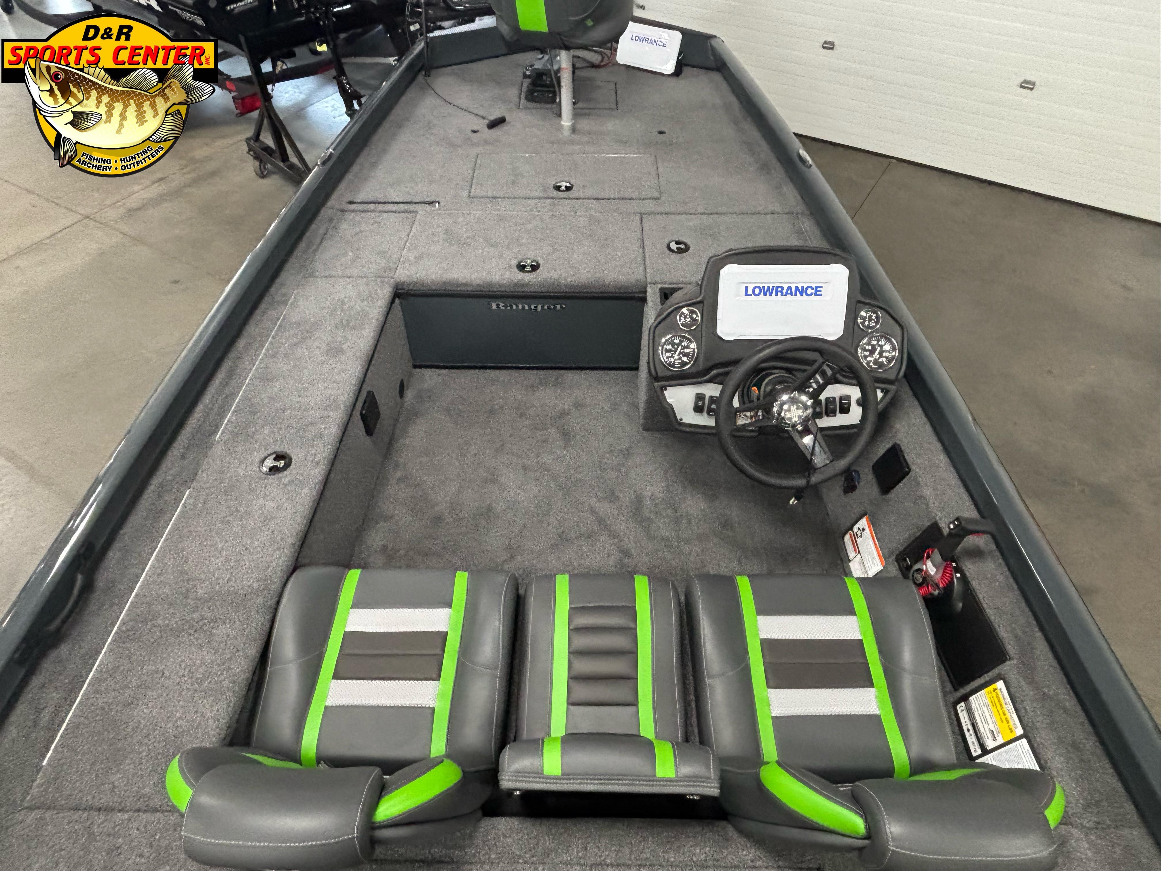 2025 Ranger RT188C boat interior with Lowrance system, gray and green seating, and steering wheel.