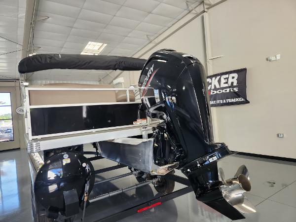 2025 Ranger 200C boat with Mercury outboard motor in showroom.