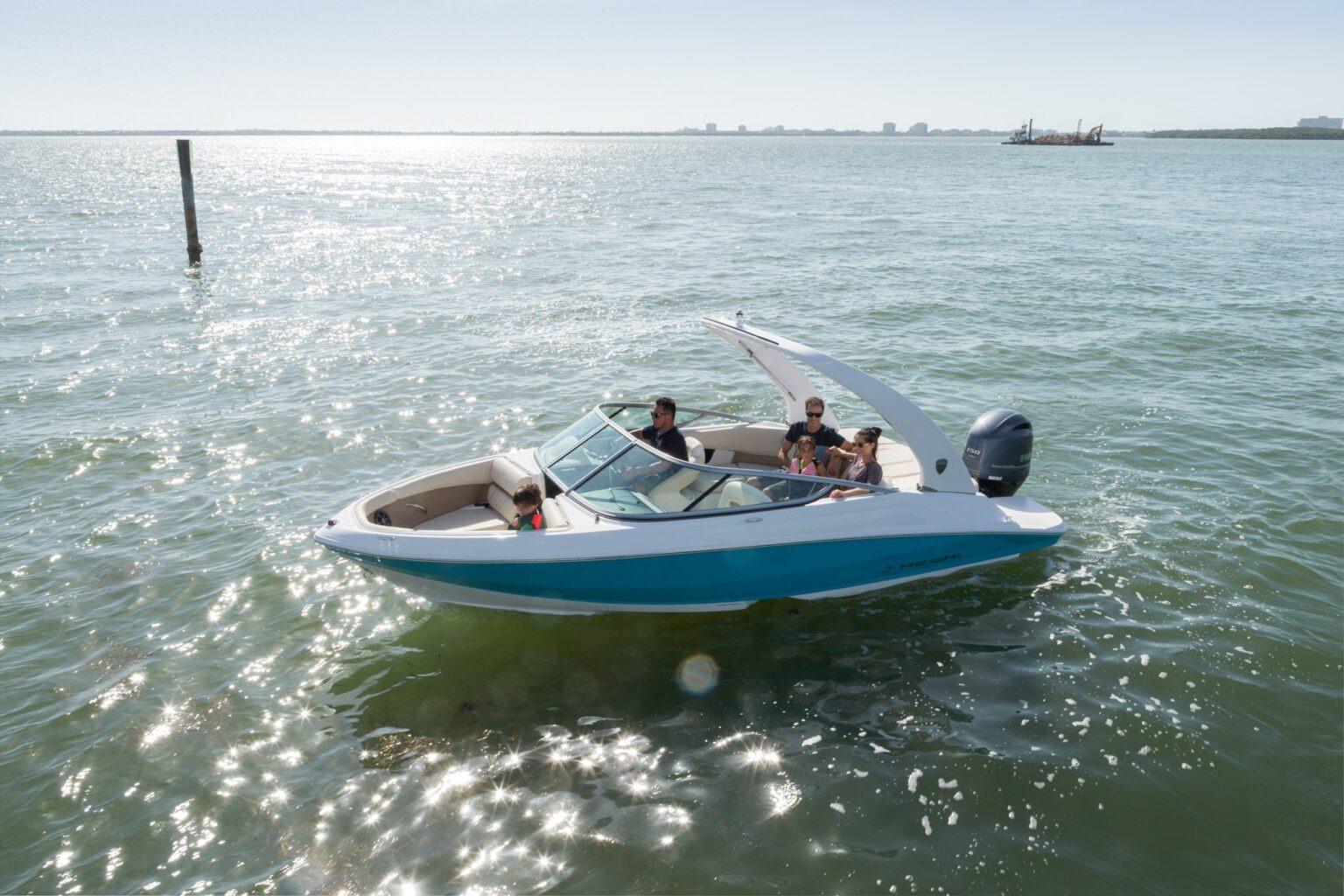 2026 Regal 21 OBX boat cruising on sunny waters with passengers onboard.