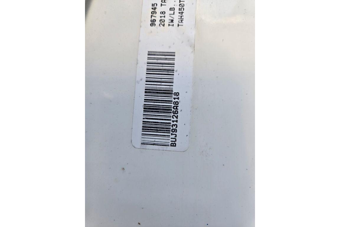 Barcode label on a 2018 Tahoe 450 TS boat, displaying serial number.
