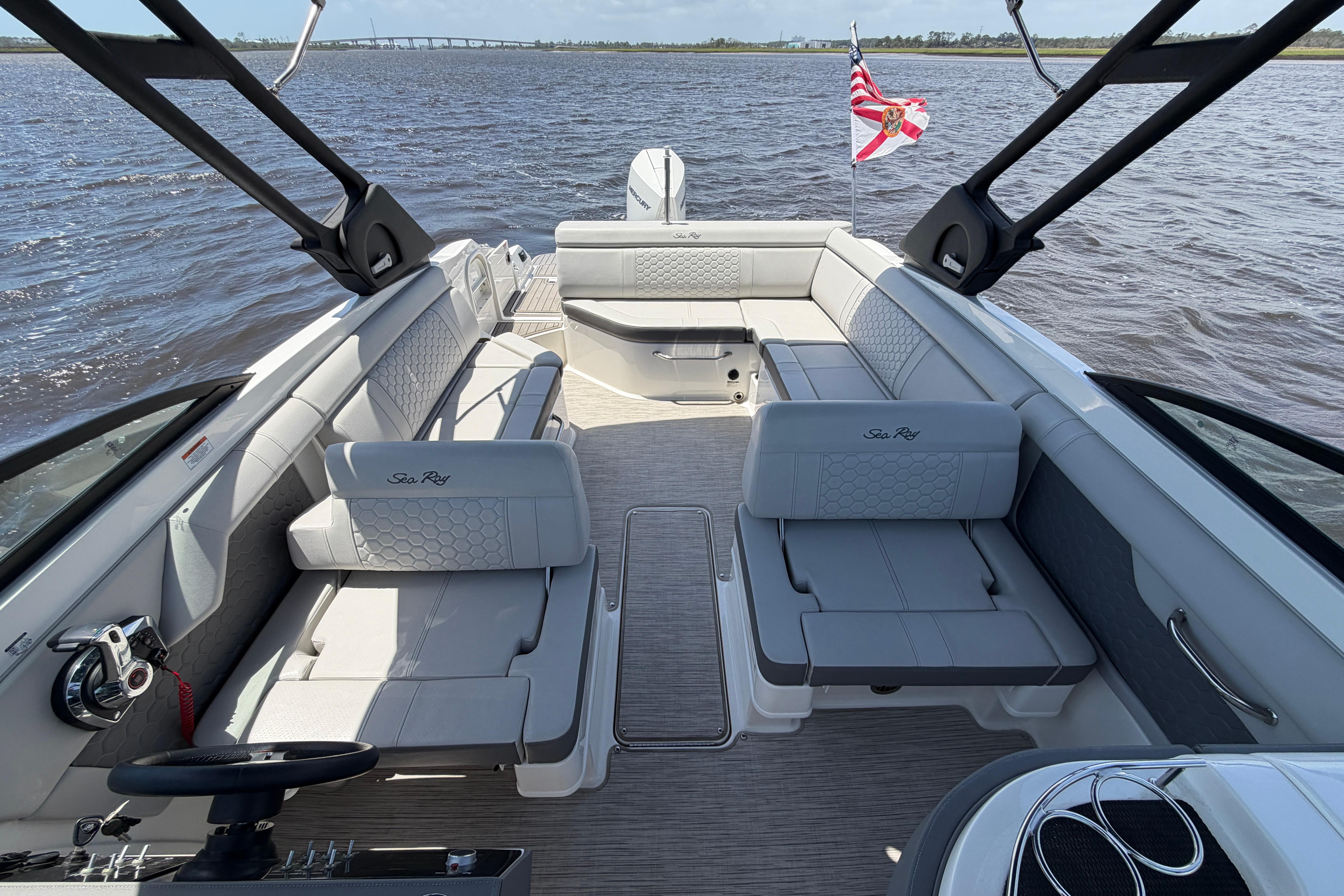 2024 Sea Ray SDX 270 Outboard boat interior with spacious seating on the water.