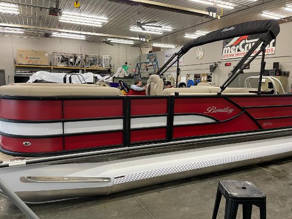 2025 Bentley Pontoons 200 Fish-N-Cruise in a showroom, featuring a sleek red and white design.