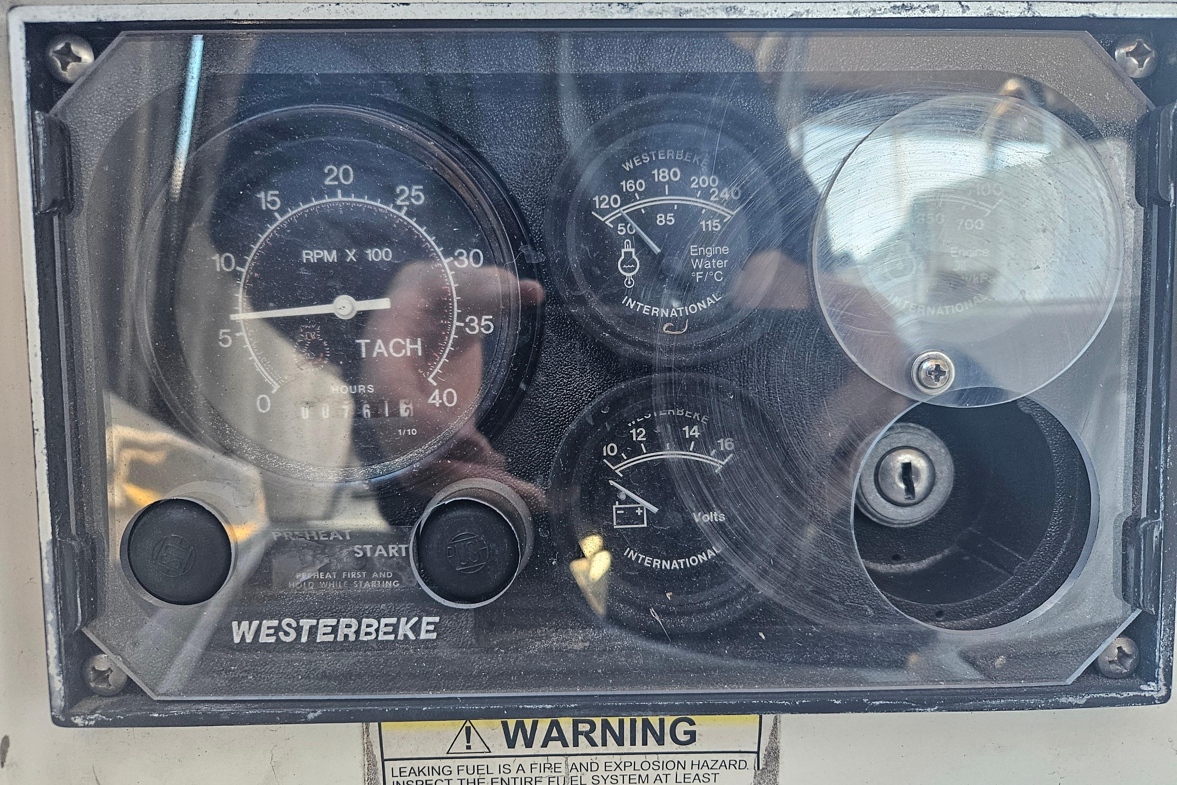 Control panel of a 1998 Beneteau 381 sailboat with Westerbeke tachometer and gauges.